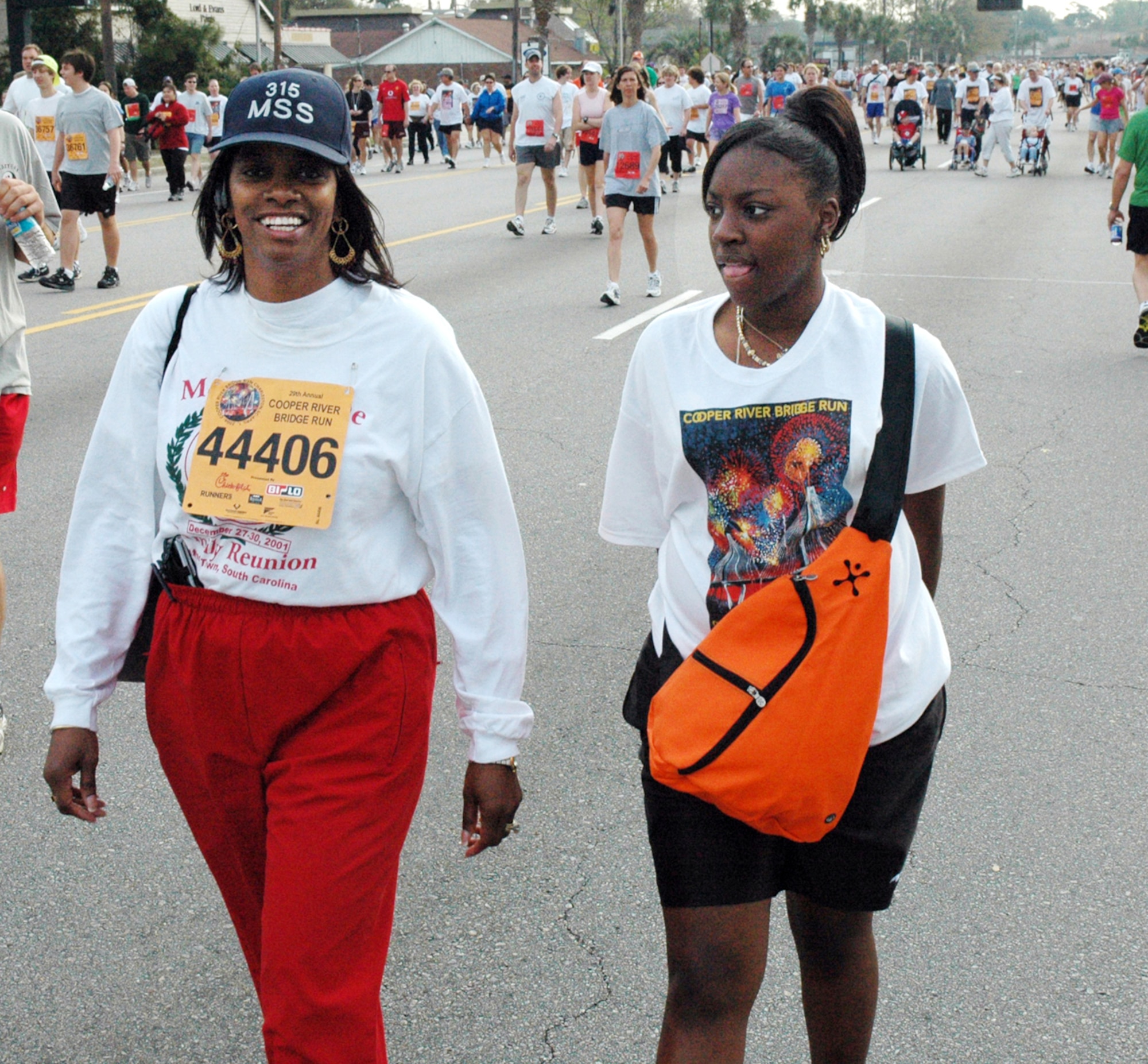Chief Master Sgt. Karen Chisolm, 315th Mission Support Squadron, and her daughter, Jazmine Wright-Chisolm, begin their walk over the new Arthur Ravenel Jr. Bridge.  Photo by Tech. Sgt. Mark Kleber, USAFR