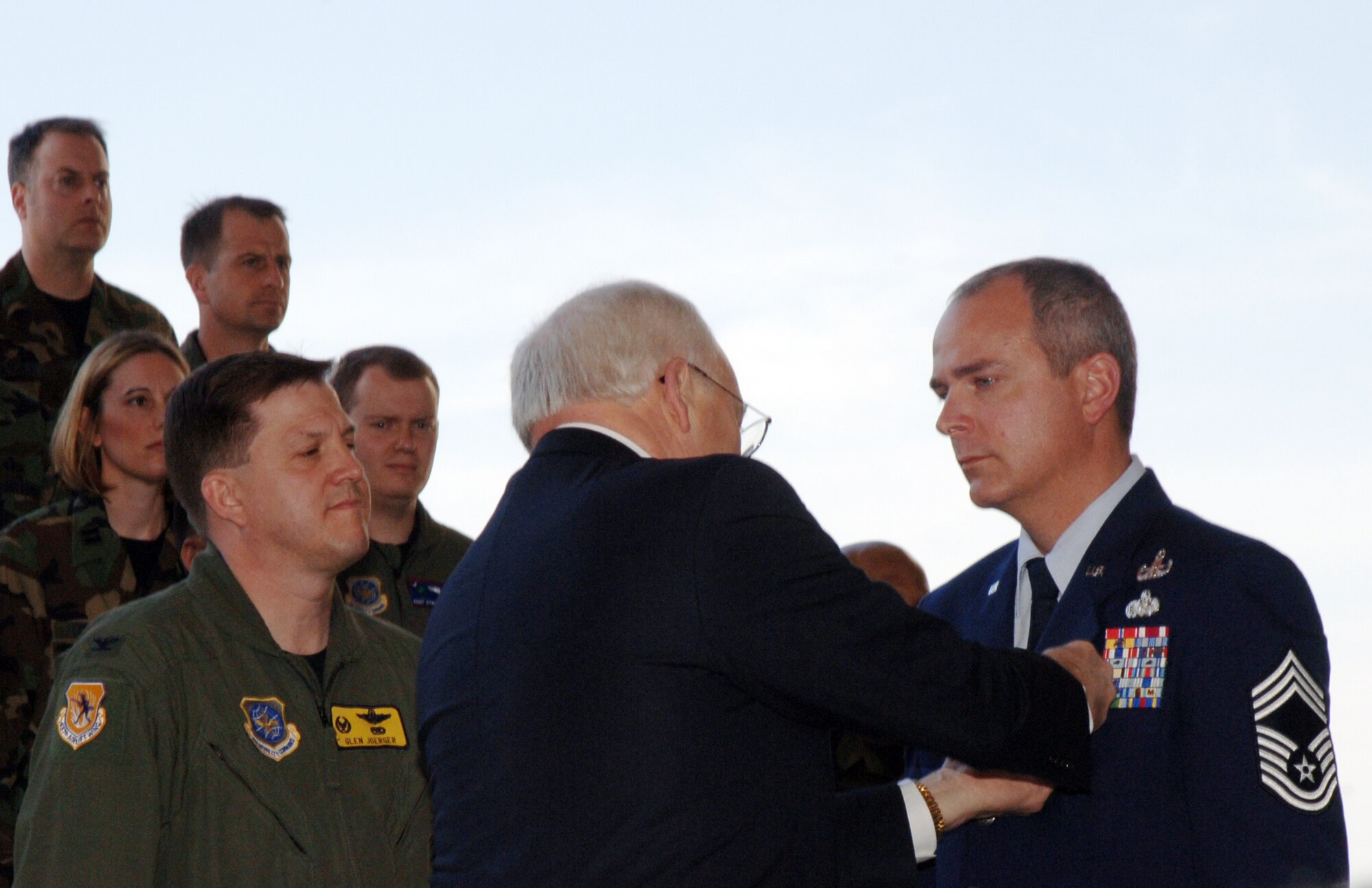Chief Master Sgt. Michael Schmiege, 315th Civil Engineer Squadron Explosive Ordnance Disposal, (right) has his Bronze Star pinned on by U.S. Vice President Dick Cheney.  Photo by Senior Airman Darnell Cannady