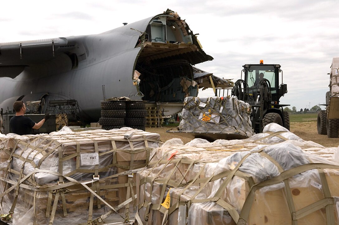 The recovery team salvages cargo on Monday, May 1, 2006, from the C-5 Galaxy that crashed at Dover Air Force Base, Del., on April 3. Any damaged cargo will go back to the shipping activity to be either repaired or replaced. Undamaged cargo was sent on to its final destination. (U.S. Air Force photo/Doug Curran) 