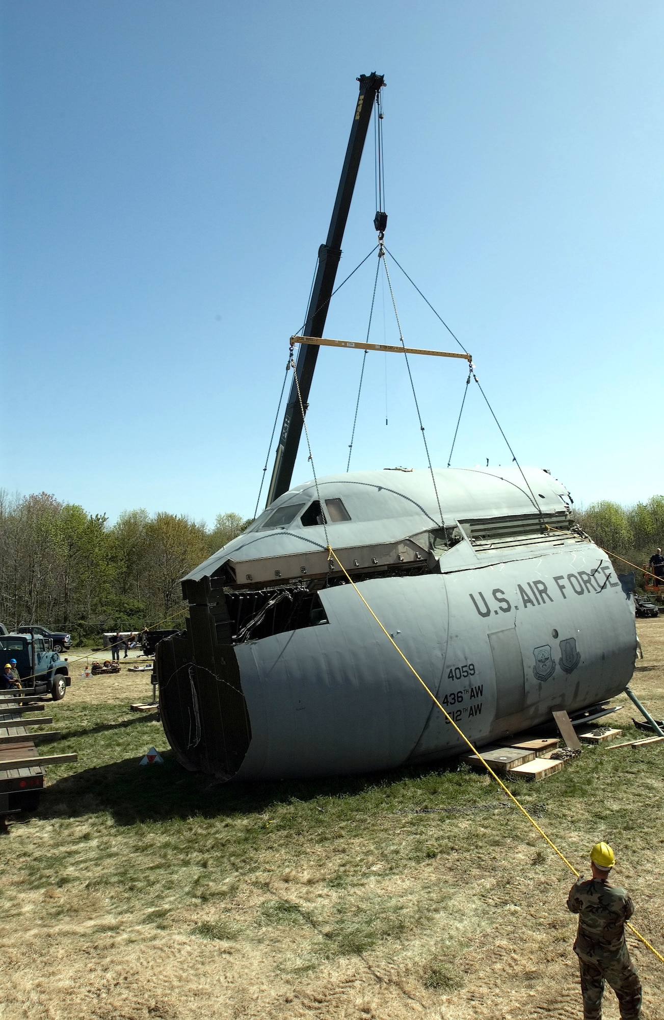 The crew compartment of the C-5 Galaxy that crashed at Dover Air Force Base, Del., April 3, is removed from the body of the aircraft by a crane on Thursday, April 20, 2006. The compartment, once it is released by the accident investigation board, is expected to be used as a training simulator. (U.S. Air Force photo/Jason Minto)
