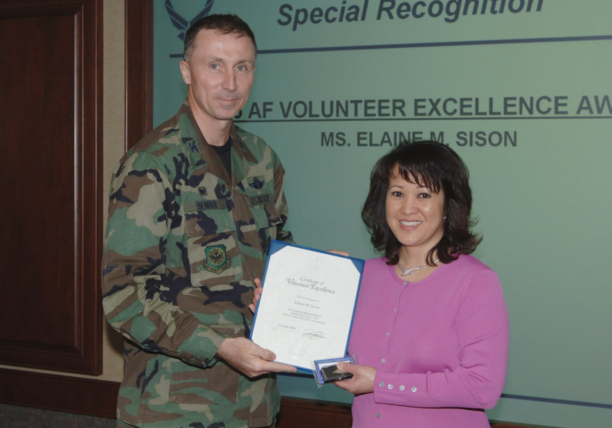 Mrs. Elaine Sison was honored by Col. Bill Bender, 319th Air Refueling Wing commander, with the Air Force Volunteer Excellence Award April 25, 2006.  The award was presented in recognition for Mrs. Sison?s support of the Red River Valley Community Action shelter providing free day care to families at the shelter.