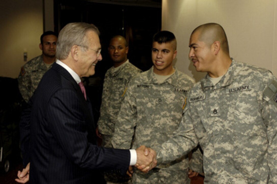 Secretary of Defense Donald H. Rumsfeld greets and speaks with Army soldiers preparing to return to Iraq and Afghanistan at the USO in the Atlanta-Hartsfield International Airport in Atlanta, Ga., on May 4, 2006. Rumsfeld is in Atlanta to speak to an audience of business and political leaders at the Southern Center for International Studies at the Atlanta History Center. 