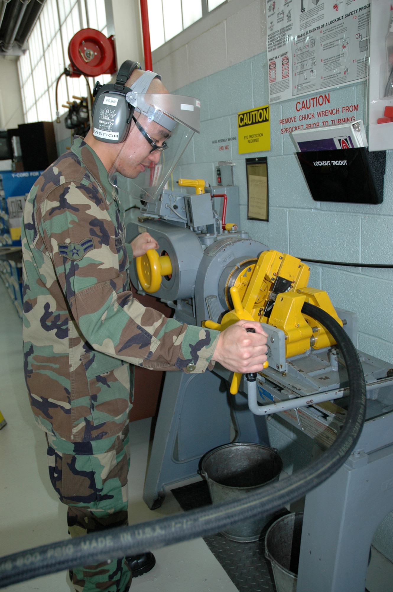 YOUNGSTOWN AIR RESERVE STATION - Air Force Reserve Airman First Class Kiet M. Chung, a aircraft hydraulic apprentice with the 910th Maintenancce Squadron here, assembles a medium pressure aerial spray hose to be installed on a Modular Aerial Spray System (MASS.)  The 910th Airlift Wing is home to the only full-time, fixed-wing aerial spray capability in the Department of Defense.