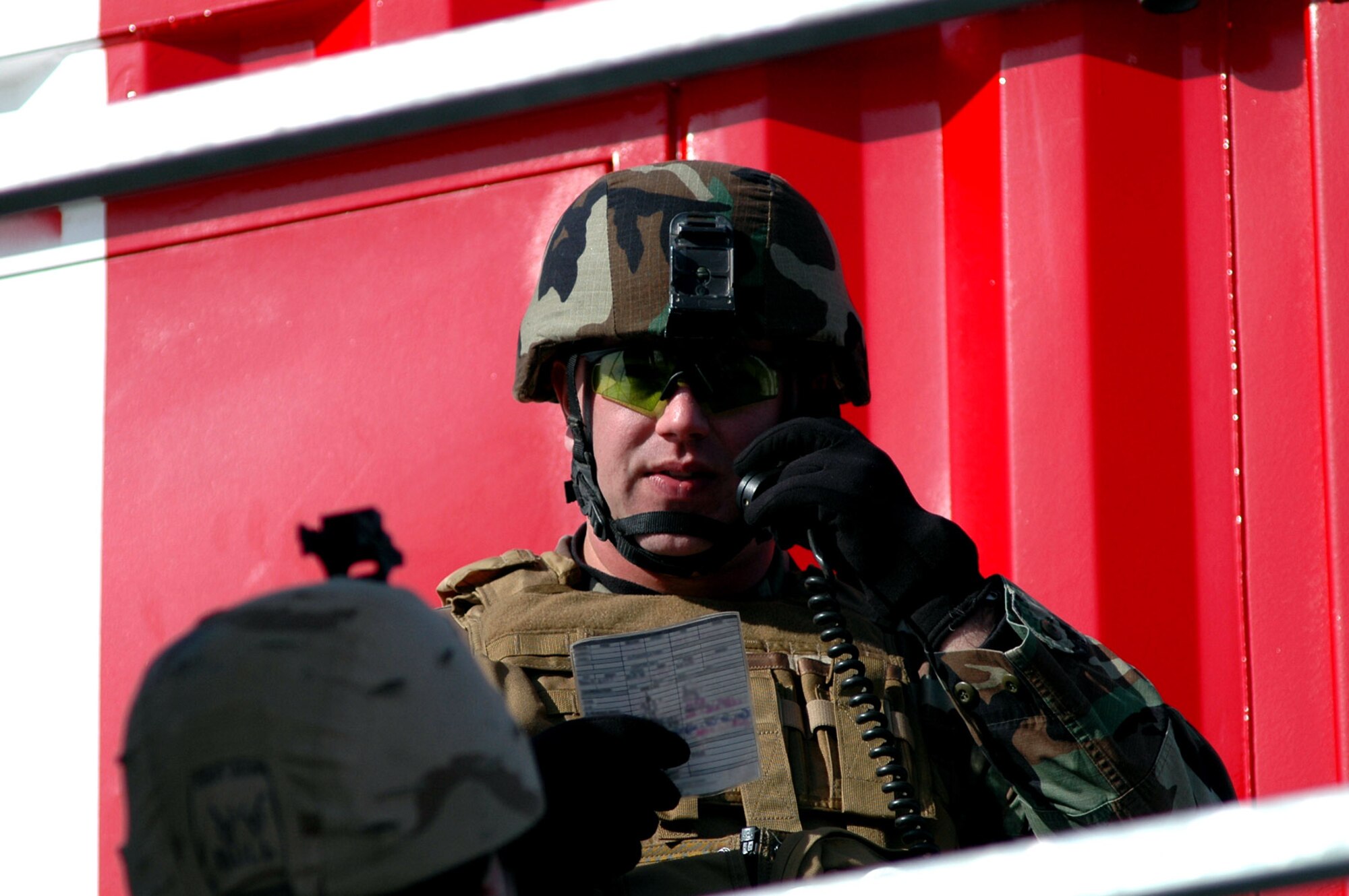 Tech. Sgt. Adam Vizi calls out coordinates for an air strike in support of  "friendly" forces at the Eielson Air Force Base, Alaska, bomb range on Friday, April 28, 2006, during Red Flag-Alaska. Sergeant Vizi is a joint terminal attack controller with the 25th Air Support Operations Squadron at Hickam AFB, Hawaii. (U.S. Air Force photo/Tech. Sgt. Jeff Walston)