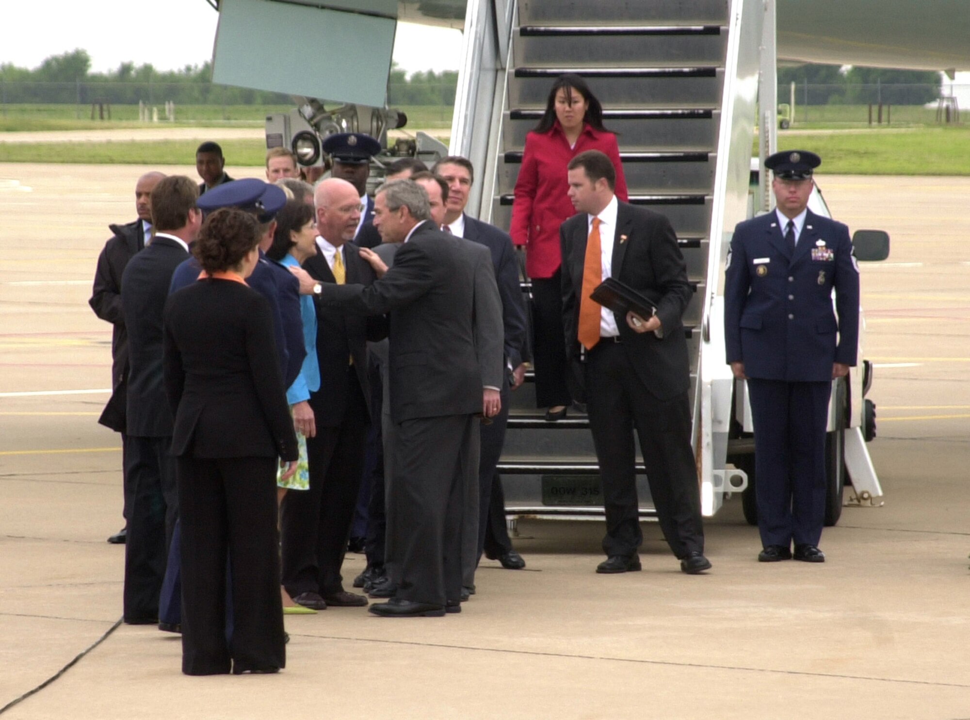 President George W. Bush speaks with Enid Mayor Ernie Currier and his wife Debbie at Vance Air Force Base, Okla., on Saturday, May 6, 2006. The president stopped at Vance on his way to Oklahoma State University in Stillwater to give the commencement address. (U.S. Air Force photo/Staff Sgt. Amanda Savannah) 
 