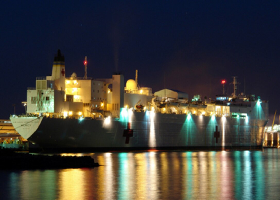 The Military Sealift Command hospital ship USNS Mercy (T-AH 19) prepares to depart Pearl Harbor, Hawaii, on May 4, 2006. The Mercy is deploying on a five-month humanitarian mission to the Western Pacific and Southeast Asia. The shipís mission is being coordinated with host nations in the region and is being carried out in conjunction with non-governmental relief organizations to provide medical, dental and other humanitarian assistance programs ashore and afloat. 