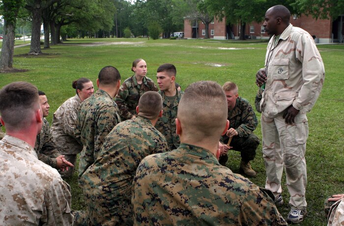 MARINE CORPS BASE CAMP LEJEUNE, N.C. (July 14, 2006) ? Master Gunnery Sgt. Freddie McDonald listens to a Marine reiterate a move during a gray belt Marine Corps Martial Arts Program class. McDonald, a maintenance support chief with Material Readiness Section, Assistant Chief of Staff, Combat Logistics Battalion 27, 2nd Marine Logistics Group, has been involved in martial arts since age 12.