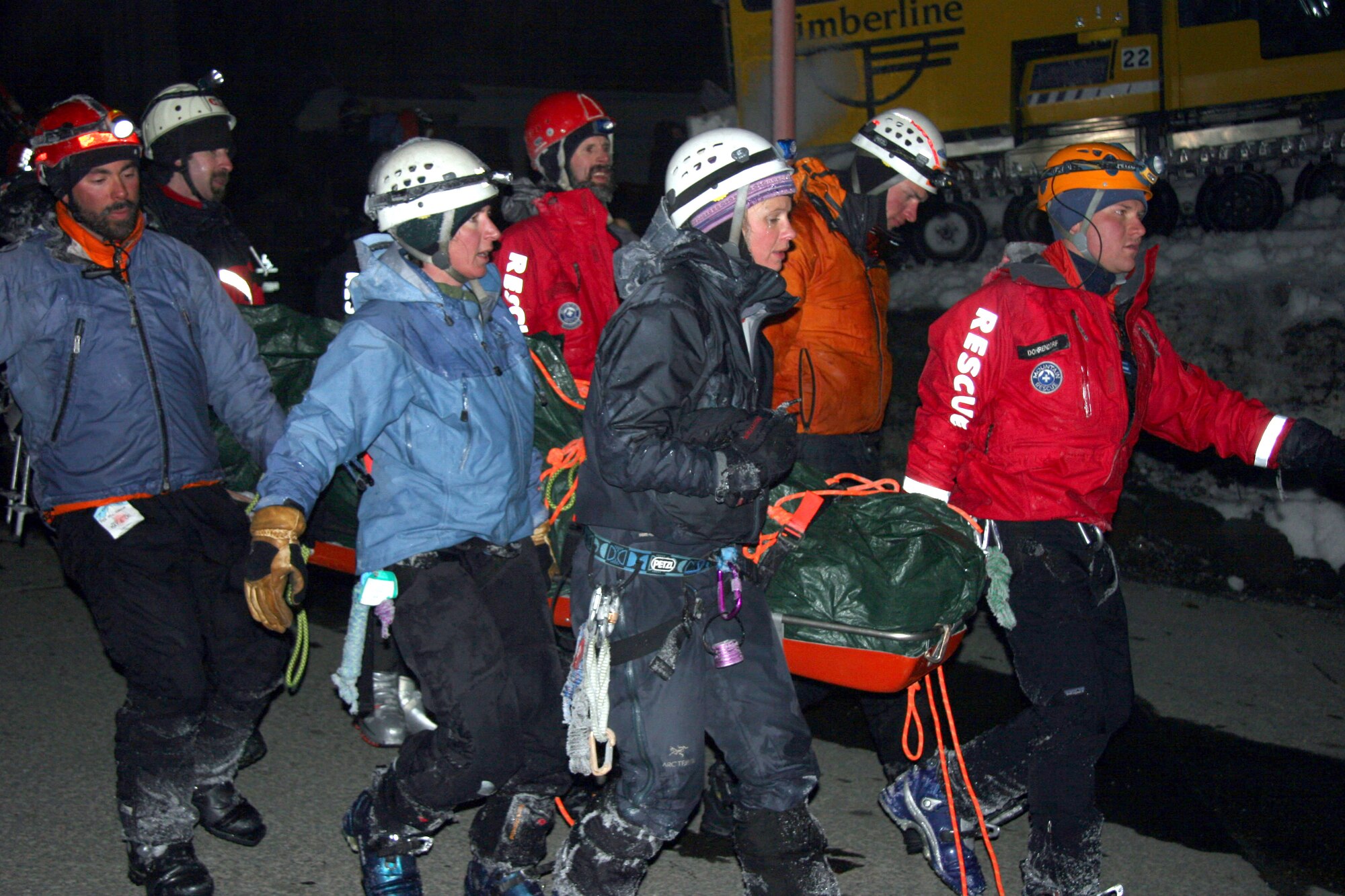 Pararescuemen from the Air Force Reserve Command's 304th Rescue Squadron, along with volunteers from local rescue organizations in Portland, Ore., worked for hours in freezing temperatures to rescue a skiing accident victim on Mount Hood. (U.S. Air Force Photo/Master Sgt. Ruby Zarzyczny)
