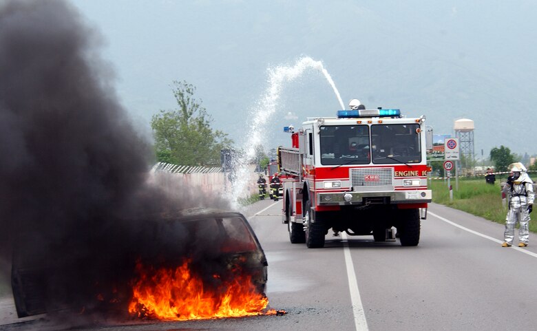Firefighters from the 31st Fighter Wing at Aviano Air Base, Italy, douse a fire during an American-Italian exercise on Thursday, May 4, 2006. Responders from various Italian fire and police departments and medical facilities joined those from the 31st FW fire department, hospital and security forces for a mass accident exercise. The purpose of the exercise is to develop a seamless response capability between Italian and American emergency professionals. (U.S. Air Force photo/Tech. Sgt. Charlein Sheets)