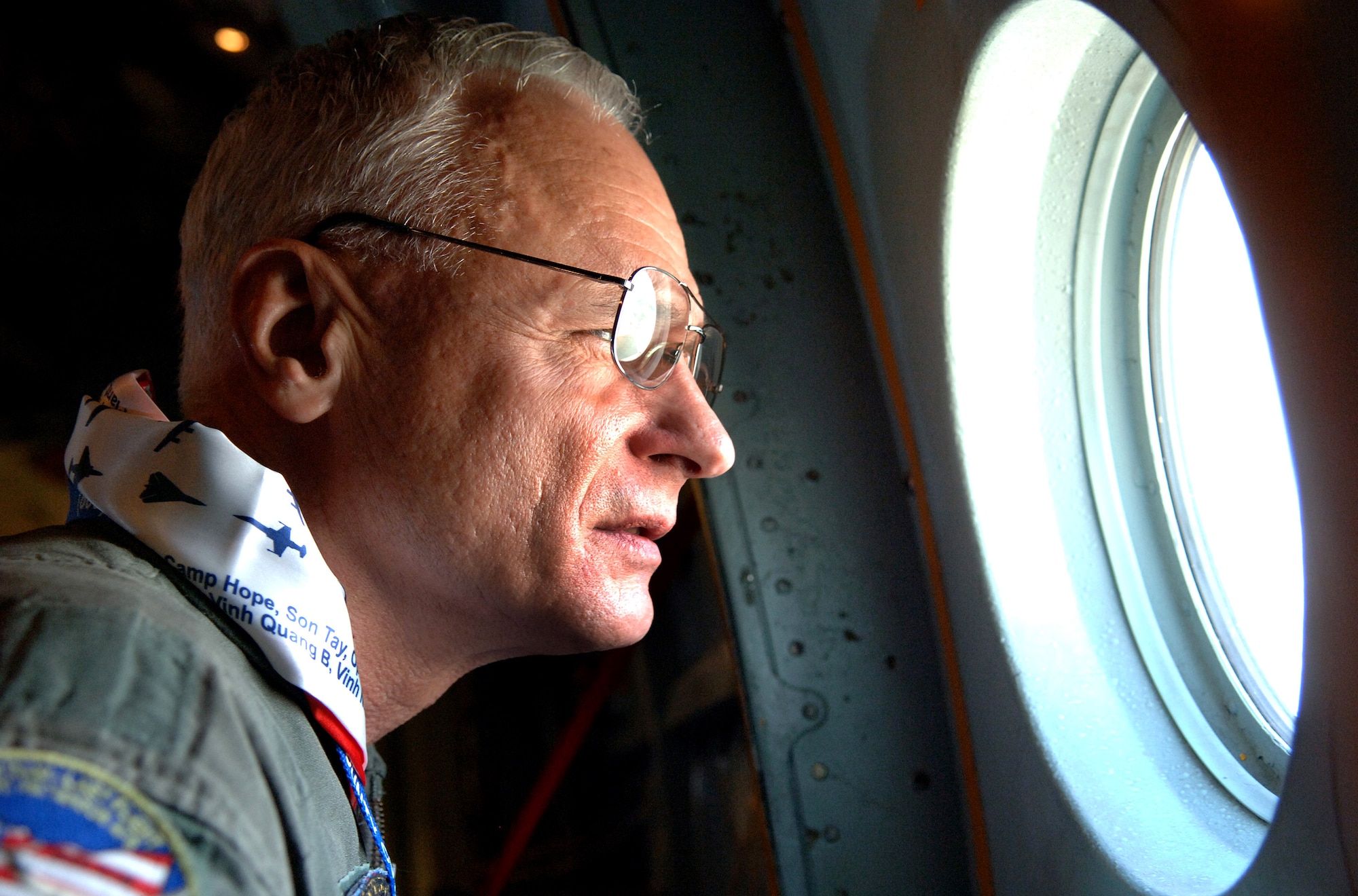 Col. Tom Moe looks out the window while flying on one of the the last missions of the C-141 "Hanoi Taxi" on Friday, May 5, 2006 over Wright-Patterson Air Force Base, Ohio. The "Hanoi Taxi" was the first aircraft to arrive in Hanoi in February 1973 to pick up prisoners of war returning to the United States. The C-141 landed at the National Museum of the United States Air Force where it will be on display this summer. (U.S. Air Force photo/Tech. Sgt. Larry A. Simmons)
