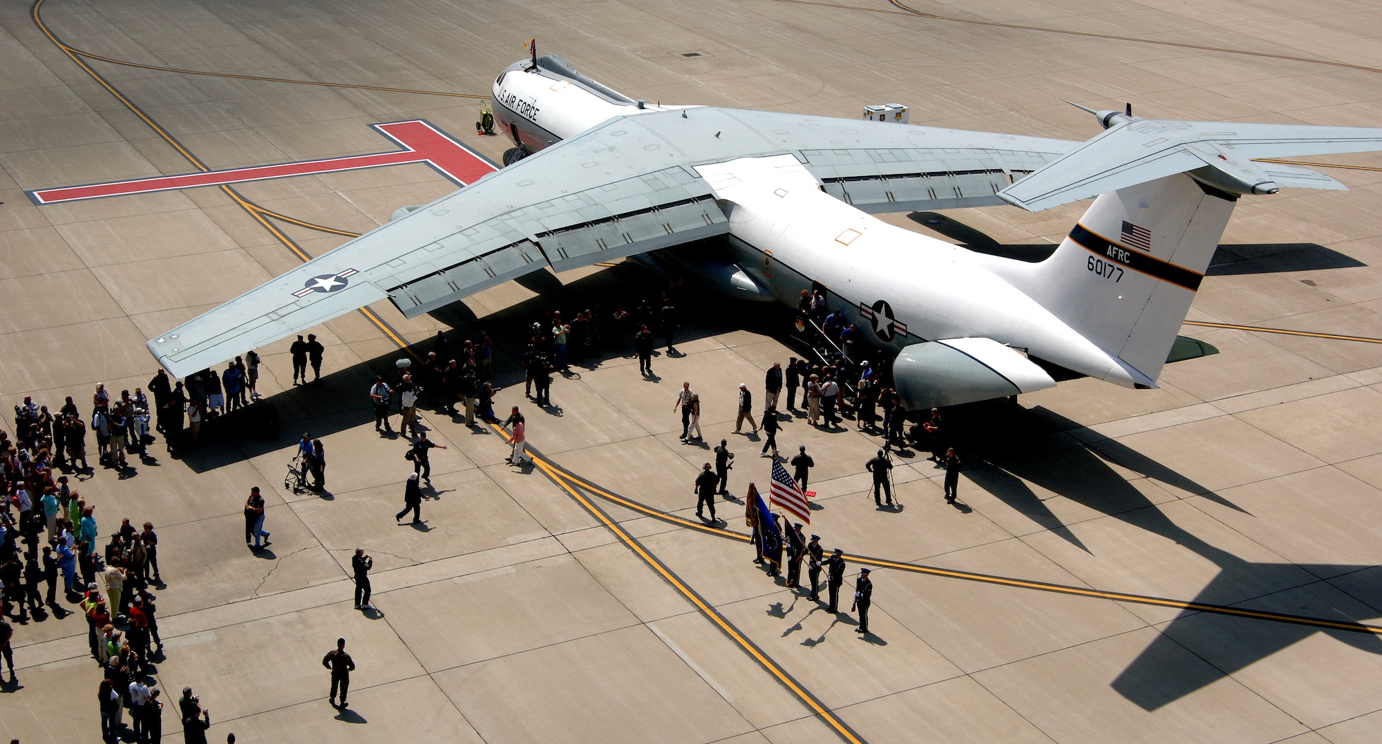 Families swarm to greet former prisoners of war moments after they landed in the C-141 "Hanoi Taxi" on Friday, May 5, 2006, at the National Museum of the United States Air Force in Dayton, Ohio. The "Hanoi Taxi" was the first aircraft to arrive in Hanoi in February 1973 to pick up POWs returning to the United States. (U.S. Air Force photo/Tech. Sgt. Larry A. Simmons)