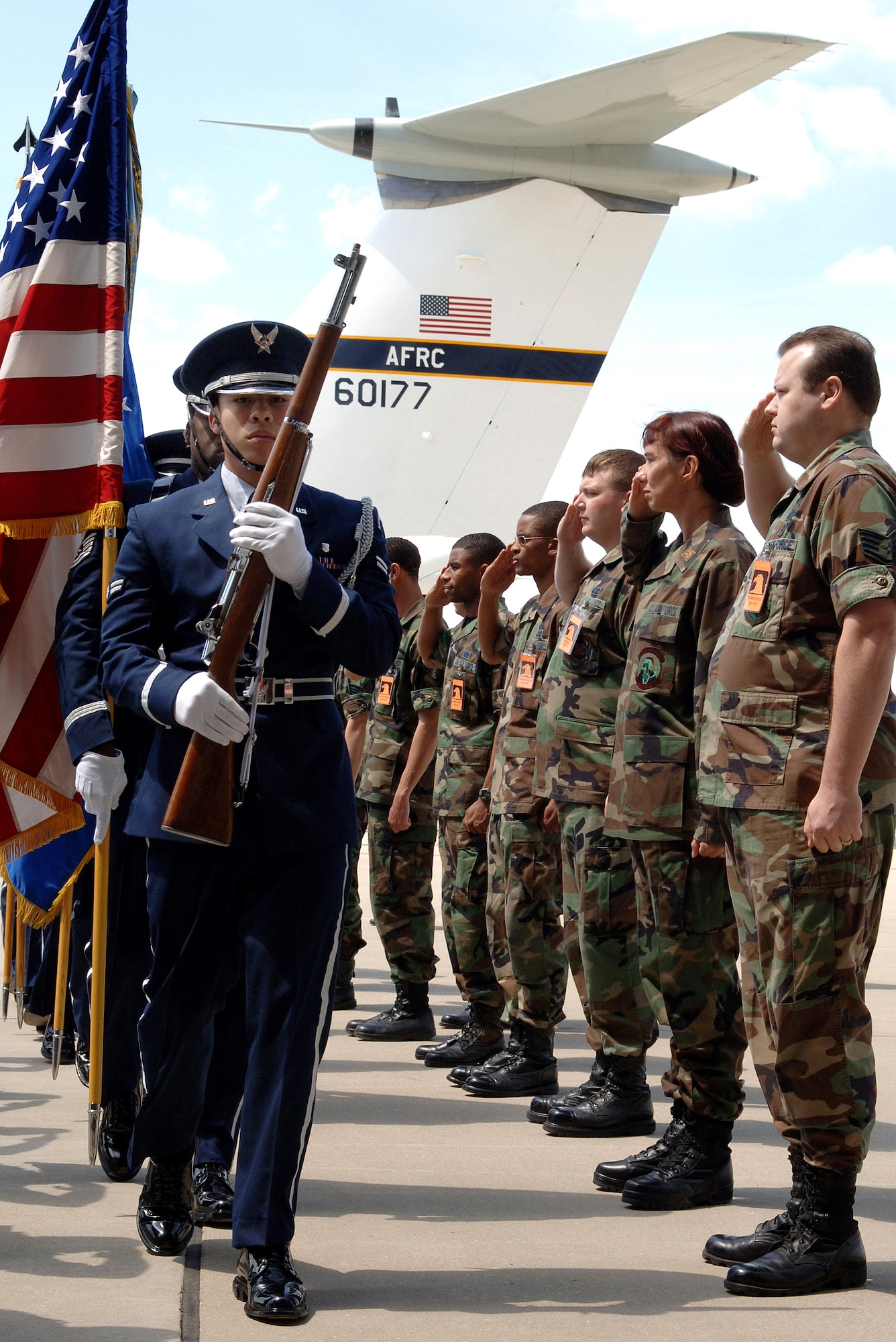 Airman 1st Class Humberto Alcocer leads the honor guard during a ceremony recognizing the last mission of the C-141 "Hanoi Taxi" on Friday, May 5, 2006, at the National Museum of the United States Air Force in Dayton, Ohio. Airman Alcocer is a member of the Wright-Patterson Air Force Base honor guard, and is with the 88th Medical Operations Squadron. (U.S. Air Force photo/Tech. Sgt. Larry A. Simmons)