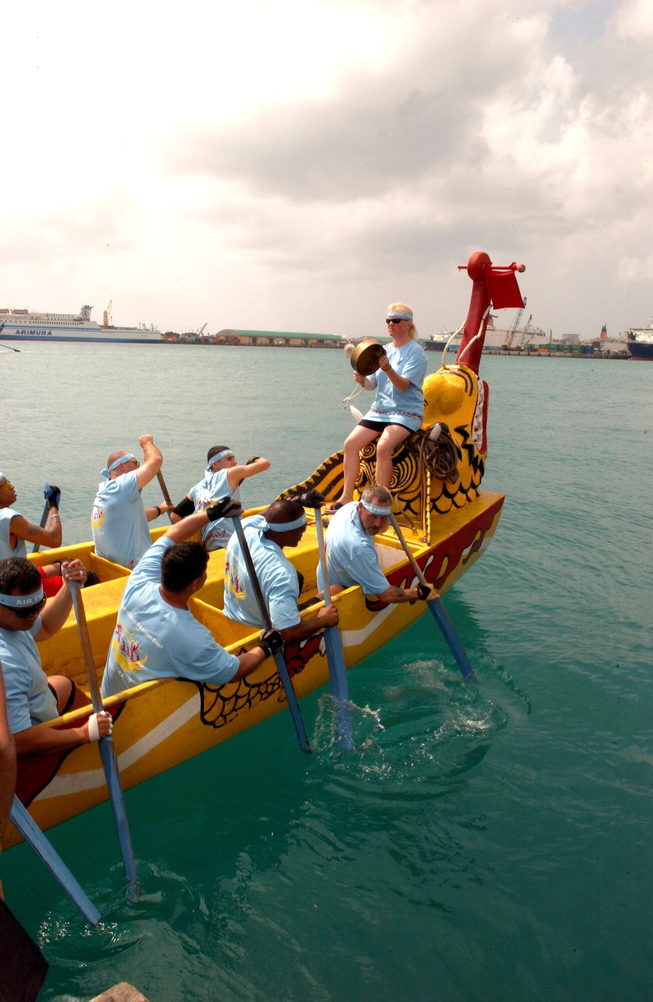 Airmen comprising the "Kadena Shoguns" dragon boat team from Kadena Air Base, Japan, race against two local teams during the 32nd Annual Naha Dragon Boat races at Naha Port, Okinawa, Japan, on Friday, May 5, 2006. More than 60 teams, including eight military teams from U.S. bases on Okinawa, competed in the annual races. Among U.S. military teams, the Air Force finished second at 5:21 minutes in the men's division. In the women's division, the Air Force also finished second at 5:57 minutes. (U.S. Air Force photo/Airman 1st Class Jeremy McGuffin)