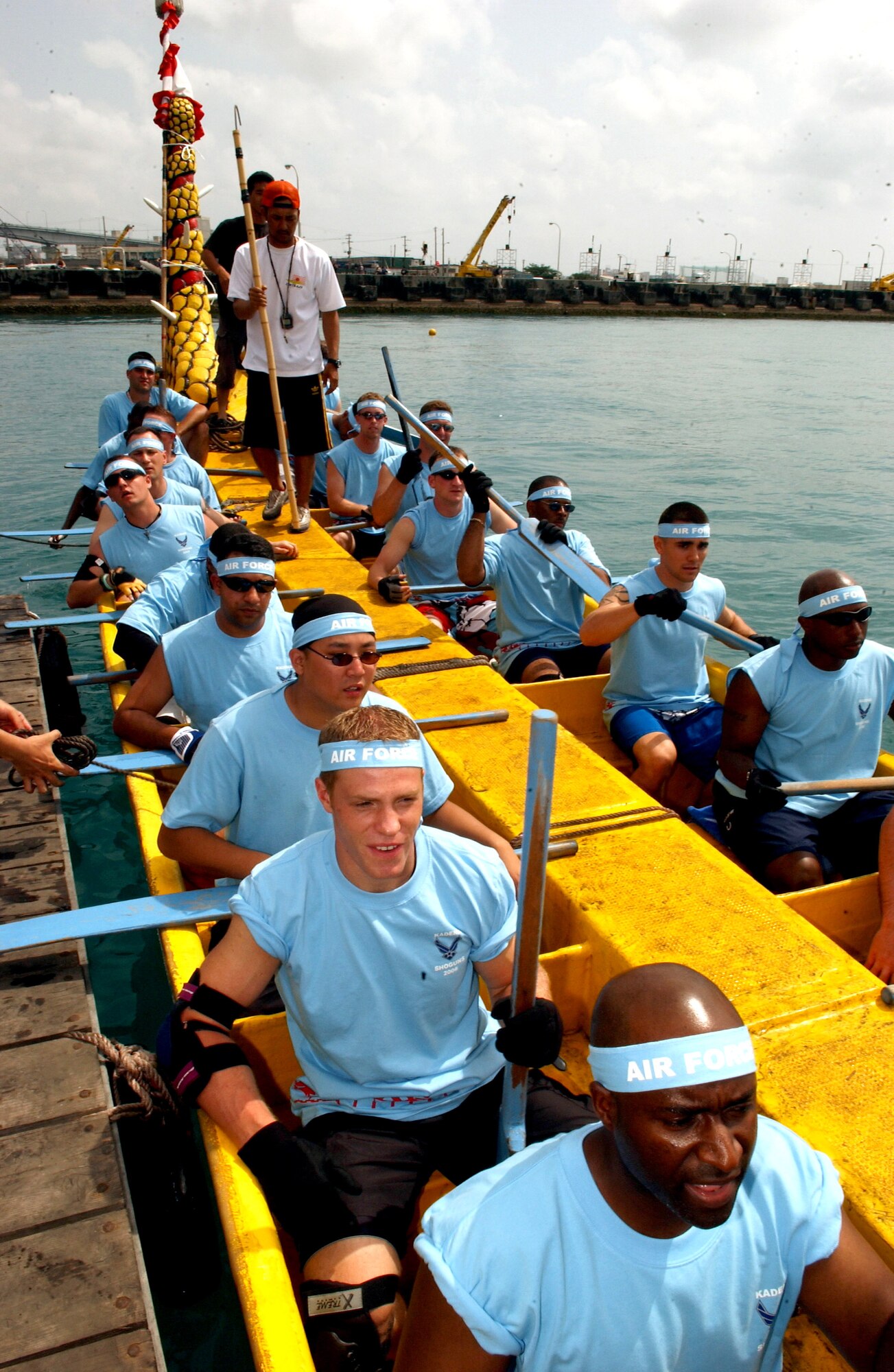 Airmen comprising the "Kadena Shoguns" dragon boat team from Kadena Air Base, Japan, prepare for a race against two local teams during the 32nd Annual Naha Dragon Boat races at Naha Port, Okinawa, Japan, on Friday, May 5, 2006. More than 60 teams, including eight military teams from U.S. bases on Okinawa, competed in the annual races. Among U.S. military teams, the Air Force finished second at 5:21 minutes in the men's division. In the women's division, the Air Force also finished second at 5:57 minutes. (U.S. Air Force photo/Airman 1st Class Jeremy McGuffin) 
