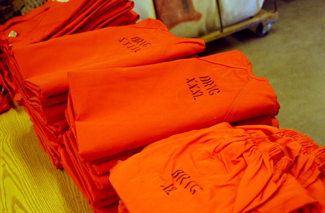 MARINE CORPS BASE CAMP LEJEUNE, N.C. - Fresh from the dryer, a batch of uniforms are neatly folded and sorted according to size. Regardless of their military occupational specialty, each prisoner of the Camp Lejeune Base Brig is assigned a new job. Inmates can choose to wash laundry, cook in the chow hall, work in the woodshop, etc. "By keeping everyone busy, it helps to minimize potential problems within the facility," said Staff Sgt. Dave S. Greeson, the duty brig supervisor. Photo by:  Lance Cpl. Drew W. Barker