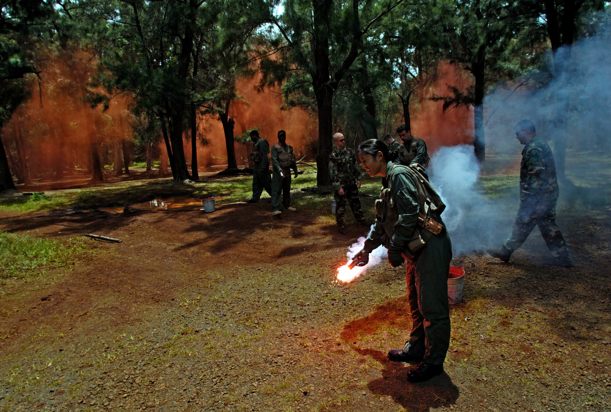 Students practice igniting survival flares during a ground survival refresher course at Schofield Barracks, Hawaii, on Thursday, May 4, 2006. The course provides realistic training for aircrew members and concentrates on the principles, techniques and skills necessary to survive in any environment. (U.S. Air Force photo/Tech. Sgt. Shane A. Cuomo)