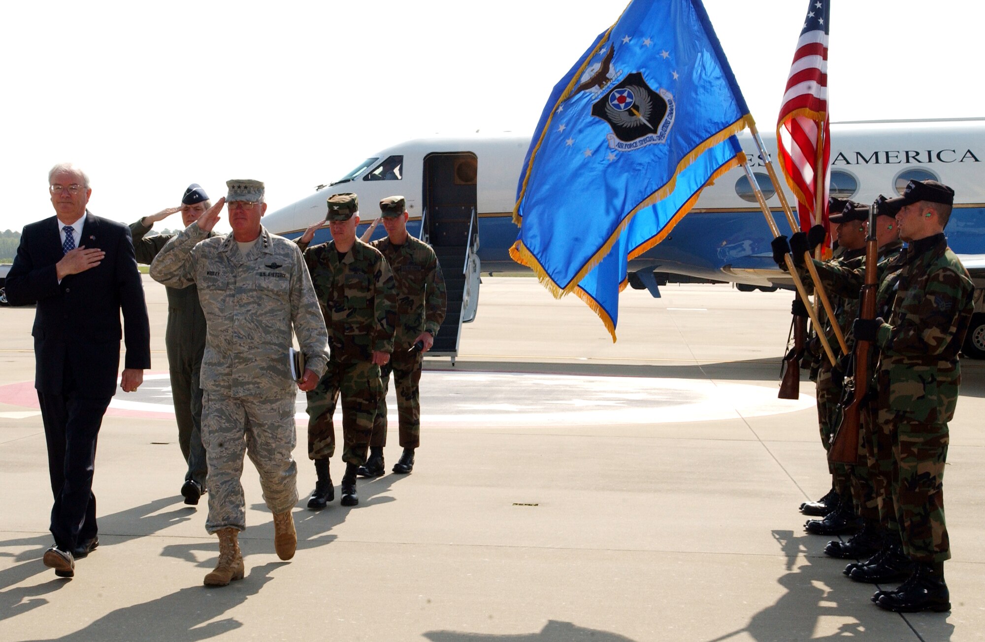 Secretary of the Air Force, Michael W. Wynne, and  Commander, Air Force Special Operations Command, Lt. Gen. Michael Wooley, walk through the Honor Guard Cordon May 9, 2006, upon Secretary Wynne's arrival to Hurlburt Field, Florida. During his one-day tour Secretary Wynne was shown the unique missions and capabilities of  Air Force Special Operations Command. ( US Air Force photo by Airman First Class Ali E. Flisek)

