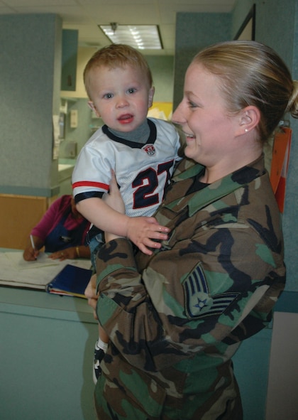 Staff Sgt. Sheena Hansen, 5th Maintenance Group, picks up her son Rylee at the Child Development Center Tuesday. (Air Force photo by Senior Airman Danny Monahan)