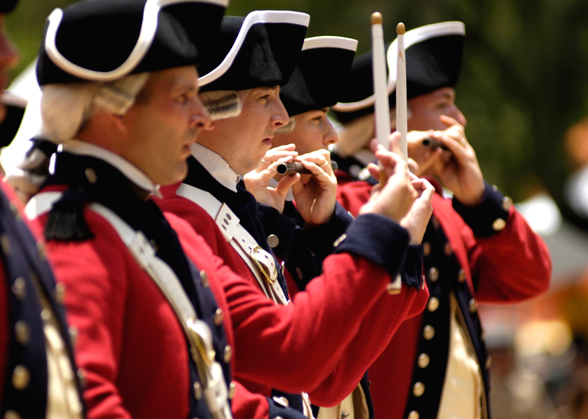 Members of the U.S. Army's Old Guard Fife and Drum Corps perform at a concert on Saturday, May 6, 2006, in downtown Honolulu. The group, part of the 3rd United States Infantry Regiment, is the only unit of its kind in the armed forces. The uniforms are patterned after those worn by the musicians in George Washington's Continental Army. The performance was part of a USO "Salute to our Troops" celebration. (U.S. Air Force photo/Tech. Sgt. Shane A. Cuomo) 

