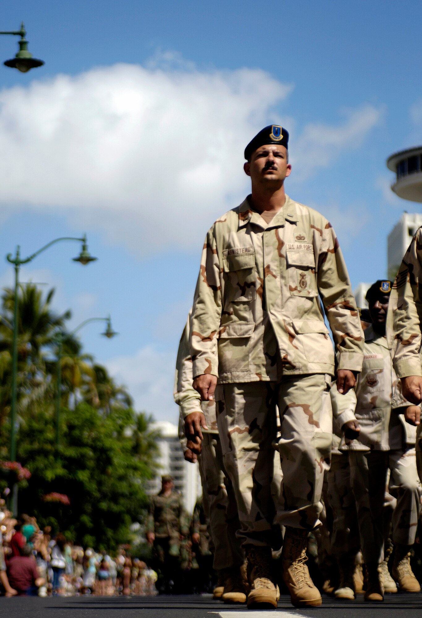 Security Forces Airmen from Hickam Air Force Base, Hawaii, who recently returned from a deployment, march in the "Salute to our Troops" parade in downtown Honolulu on Saturday, May 6, 2006. The USO hosted the parade which included active-duty, Guard and Reserve members of all the services. (U.S. Air Force photo/Tech. Sgt. Shane A. Cuomo) 