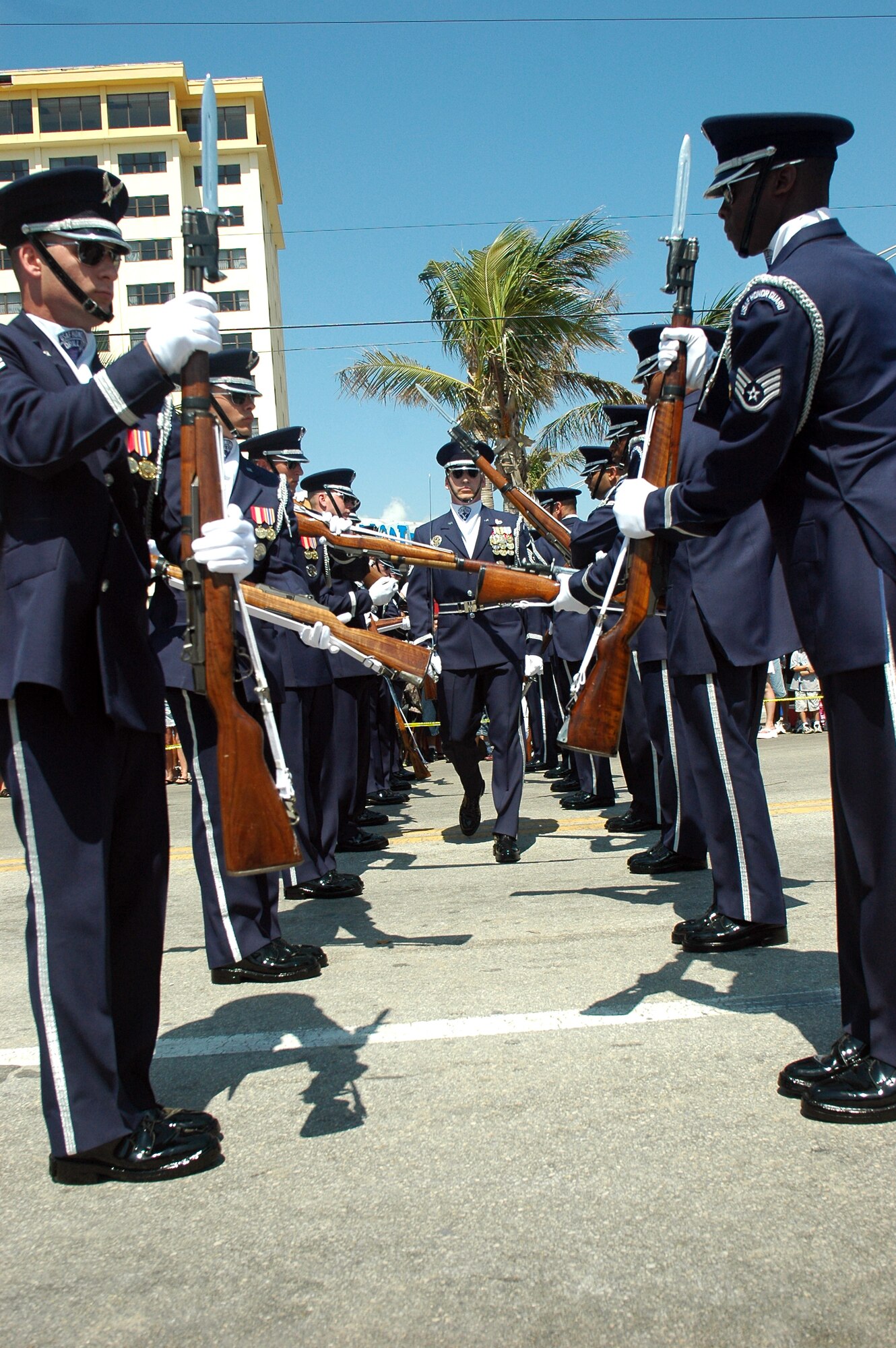 Master Sgt. Jacob Pulling, drill team commander, walks through a gauntlet of spinning rifles during a performance at the 2006 Air and Sea Show May 4 to 7 in Fort Lauderdale, Fla. (U.S. Air Force photo/Staff Sgt. Madelyn Waychoff) 
