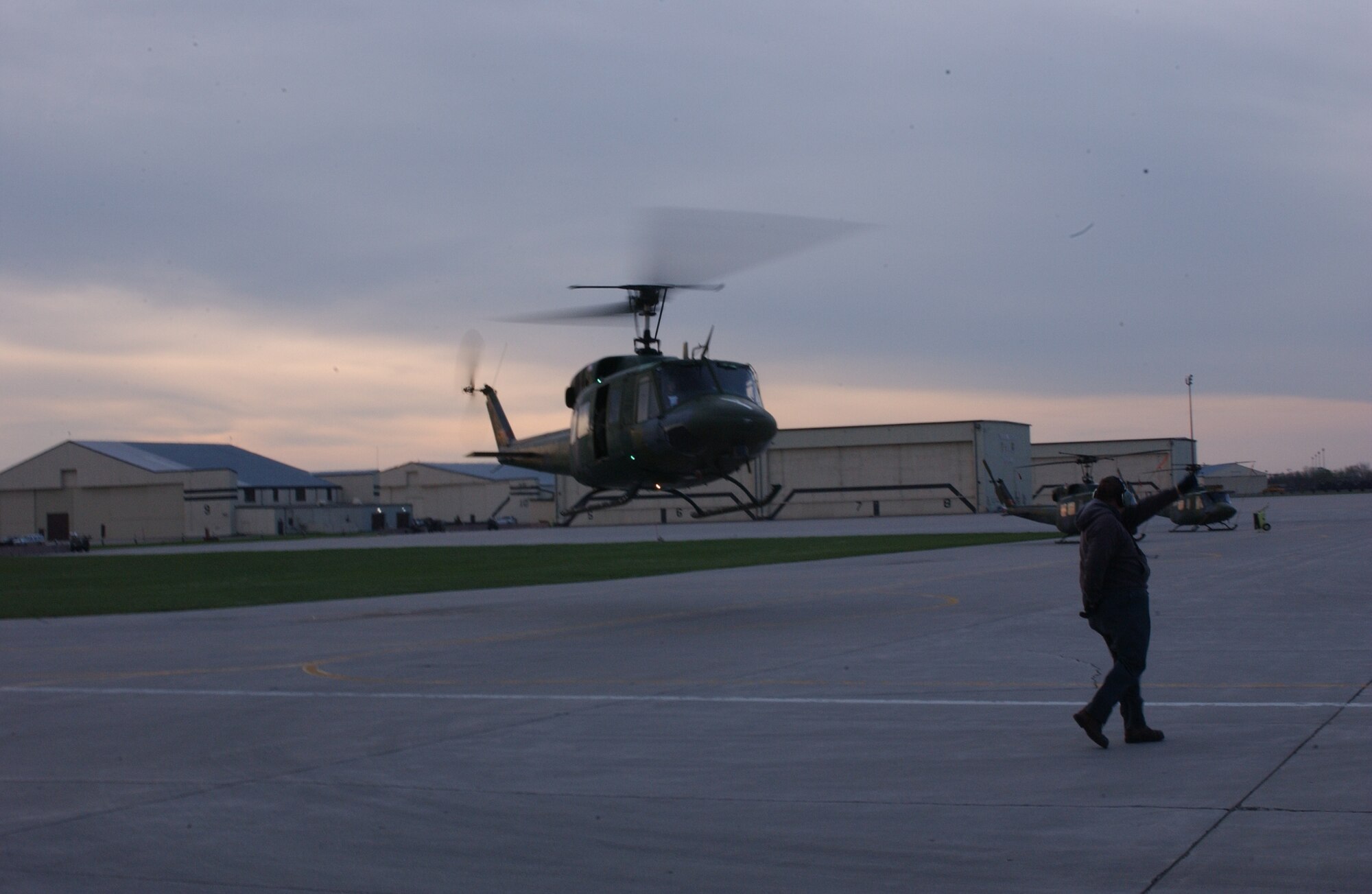 A UH-1N “Huey” helicopter from the 54th Helicopter Squadron here lifts off on its way to Camp Guernsey, Wyo., Monday to participate in the helicopter competition for Guardian Challenge 2006 as a crew chief looks on. Guardian Challenge is a competition  which tests the wartime readiness of Air Force Space Command specialists in spacelift, intercontinental ballistic missile operations, communications, maintenance, helicopter operations, security forces, and food preparation. 
