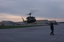 A UH-1N “Huey” helicopter from the 54th Helicopter Squadron here lifts off on its way to Camp Guernsey, Wyo., Monday to participate in the helicopter competition for Guardian Challenge 2006 as a crew chief looks on. Guardian Challenge is a competition  which tests the wartime readiness of Air Force Space Command specialists in spacelift, intercontinental ballistic missile operations, communications, maintenance, helicopter operations, security forces, and food preparation. 