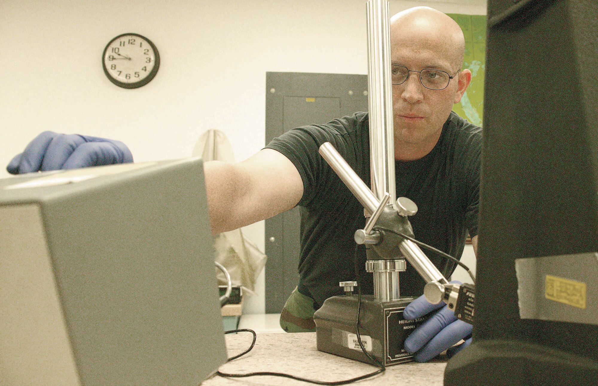 Senior Airman Brian Larson, 20th CMS PMEL technician, calibrates a height measuring guage.  (U.S. Air Force Photo/Senior Airman John Gordinier)