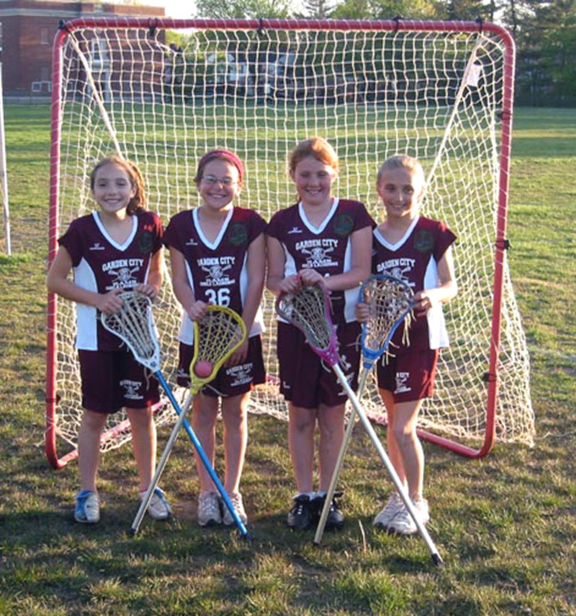 Members of the Gray Sweeties, a youth lacrosse team in Garden City, N.Y., wear patches on their uniforms from the 43rd Logistics Readiness Squadron at Pope Air Force Base, N.C. The team has dedicated their season to the unit. (Courtesy photo)
