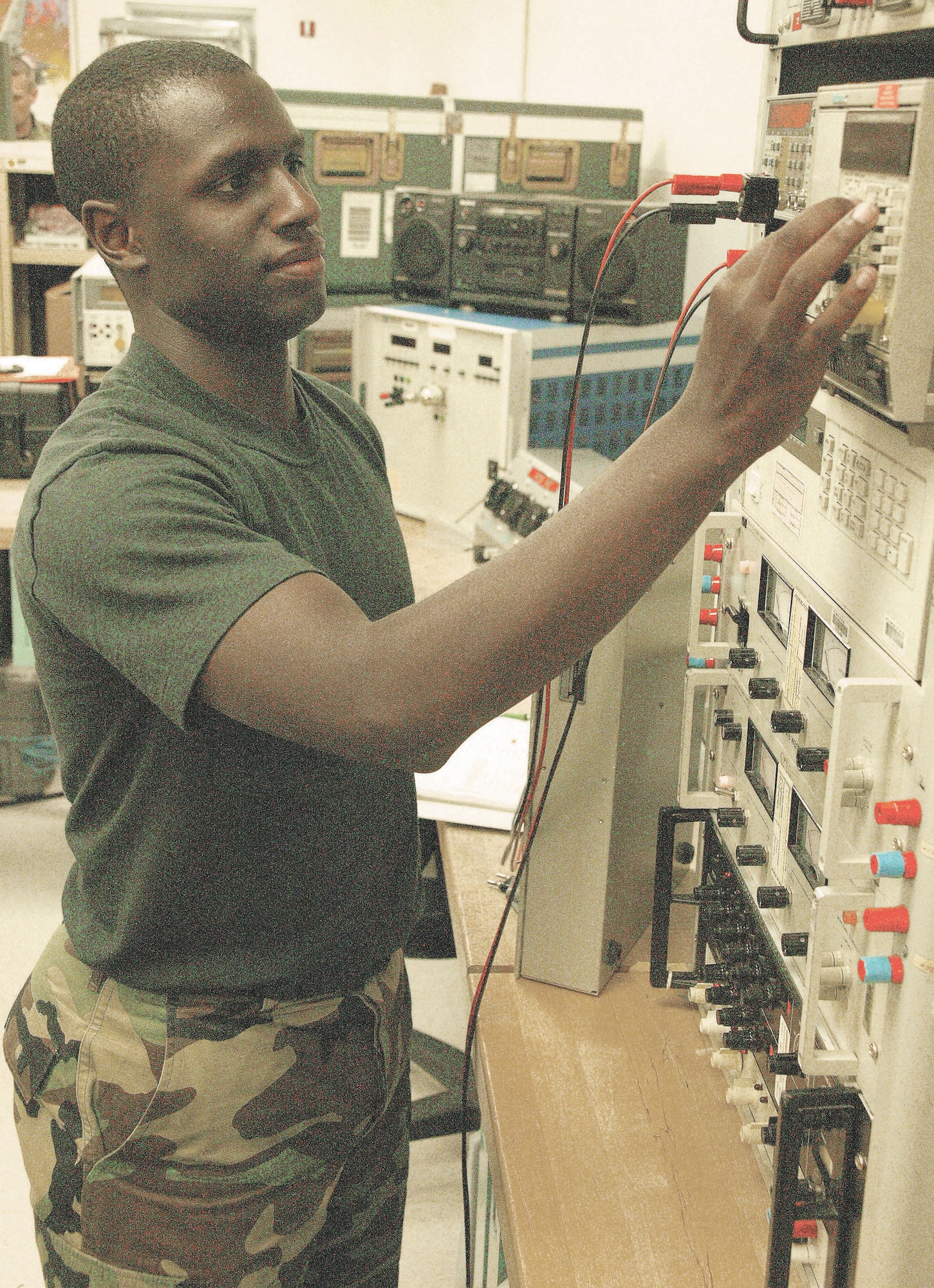 Airman 1st Class Cory Thompson, 20th CMS precision measurement equipment laboratory technician, checks the frequency of a calibrating device.  (U.S. Air Force Photo/Senior Airman John Gordinier)
