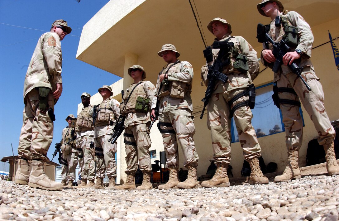 Chief Master Sgt. Layton Clark addresses Airmen about to go on duty at the Mosul Public Service Academy in Mosul, Iraq. Chief Clark is the 332nd Air Expeditionary Wing command chief. (U.S. Air Force photo/Senior Airman Jason Ridder)