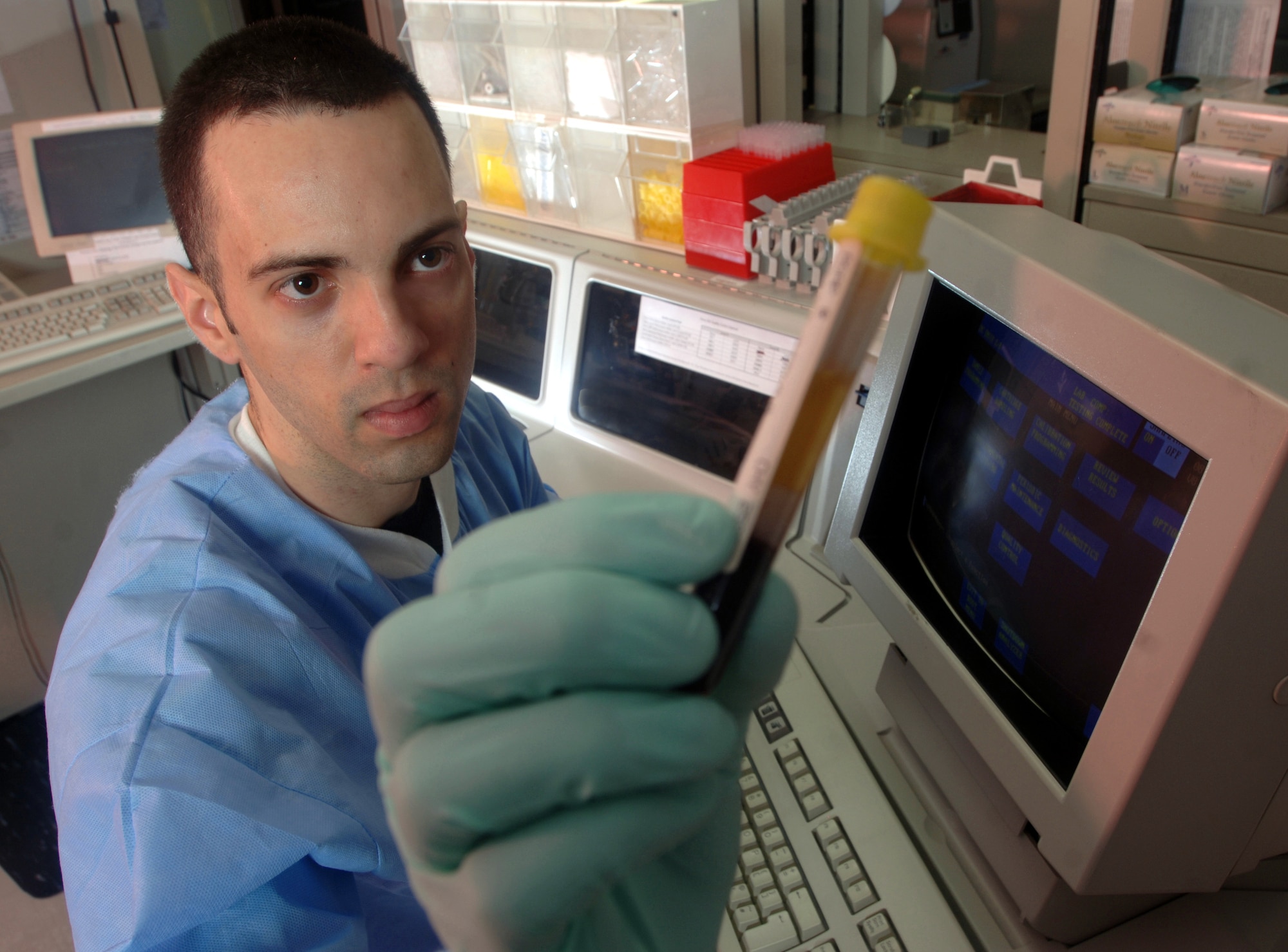 Senior Airman Eduardo Garcia-Perez prepares to run a test on a specimen at Yokota Air Base, Japan, on Thursday, May 11, 2006. Airman Garcia-Perez is a medical laboratory technician with the 374th Medical Group. His laboratory performs more than 48,000 tests annually. (U.S. Air Force photo/Val Gempis) 
