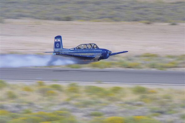 Aviatrix Julie Clark and her T-34 Mentor, seen here in an air show fly-by, will be performing at the Grand Forks Air Force Base air show, “Thunder over the Red River,” July 22.
