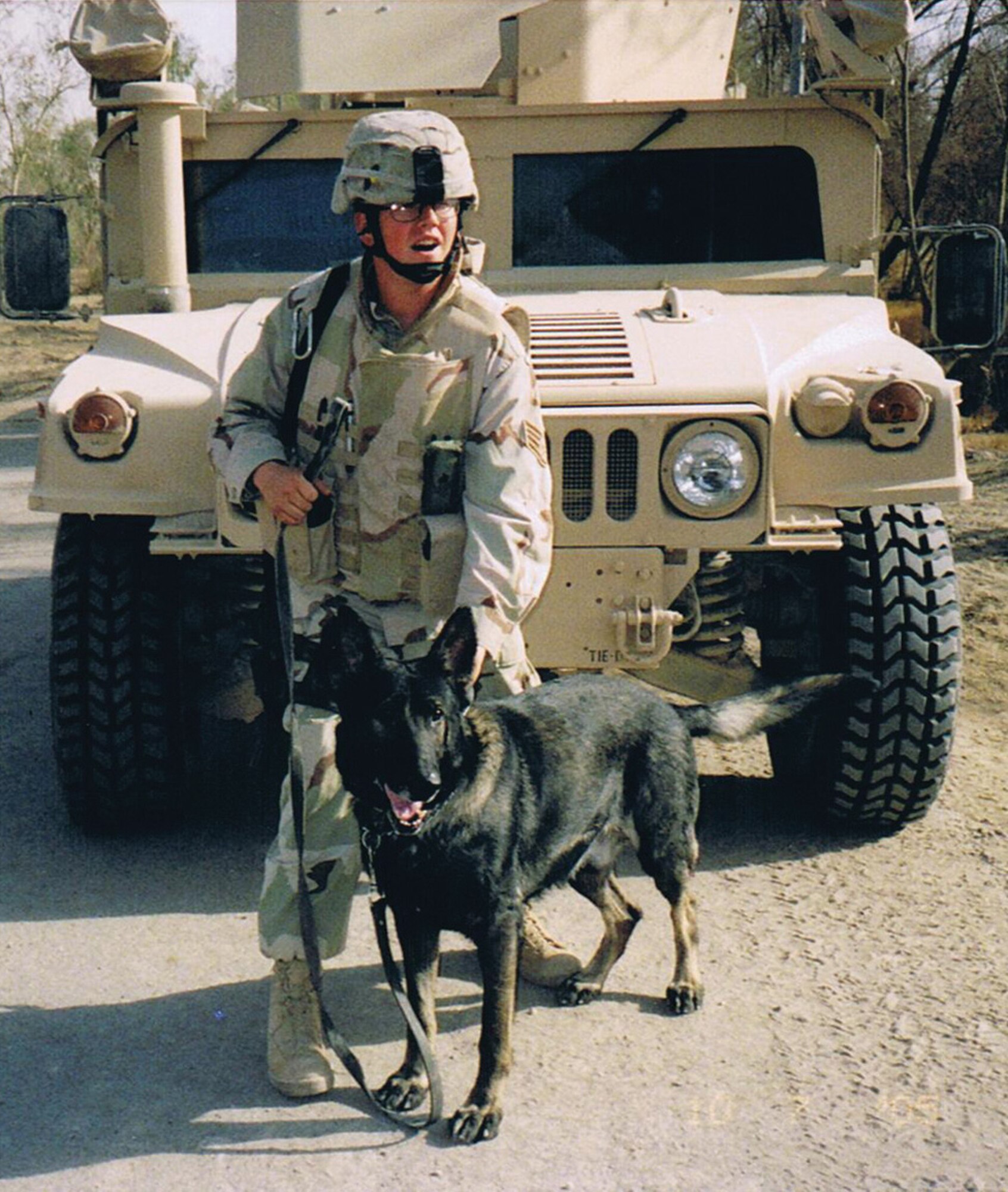 Staff Sgt. Nathanael Meagher and his military working dog, Aladar, on patrol in Iraq.  The heroic K-9 team were awarded the Army Commendation Medal and Combat Action Badge for finding numerous weapons and explosives caches while engaging enemy forces.
