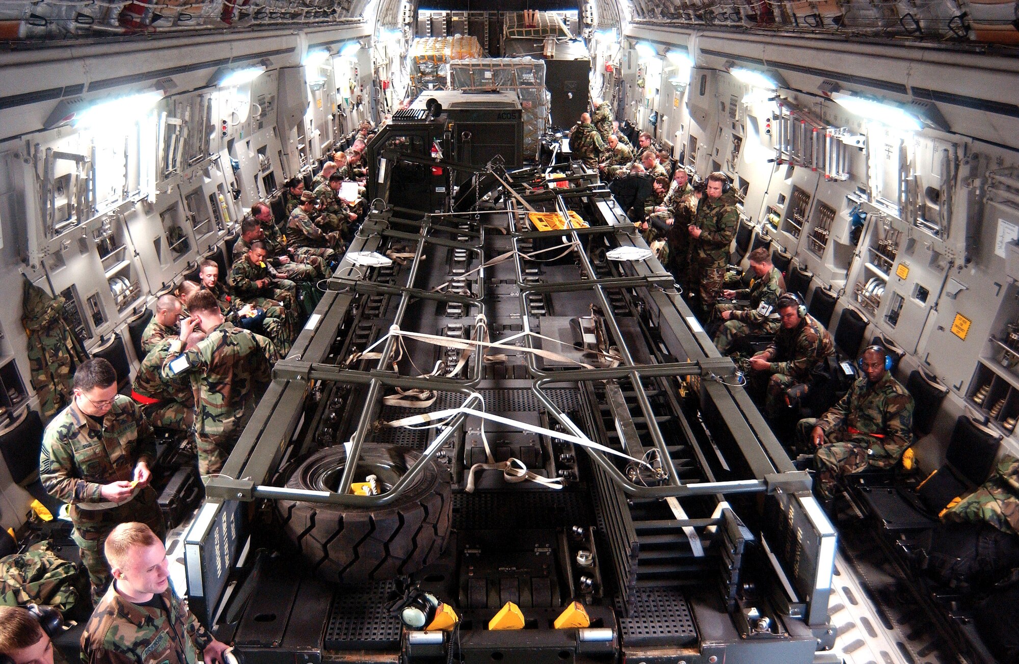 Airmen from McChord Air Force Base, Wash., sit on a C-17 Globemaster III waiting to "deploy" to Exercise Thunderbolt at Alpena, Mich., on Saturday, May 6, 2006. More than 650 Airmen from the 62nd and 446th Airlift Wings at McChord joined 425 Airmen from Grand Forks Air Base, N.D., for the mobility exercise. (U.S. Air Force photo/Kevin Tosh Jr.)
