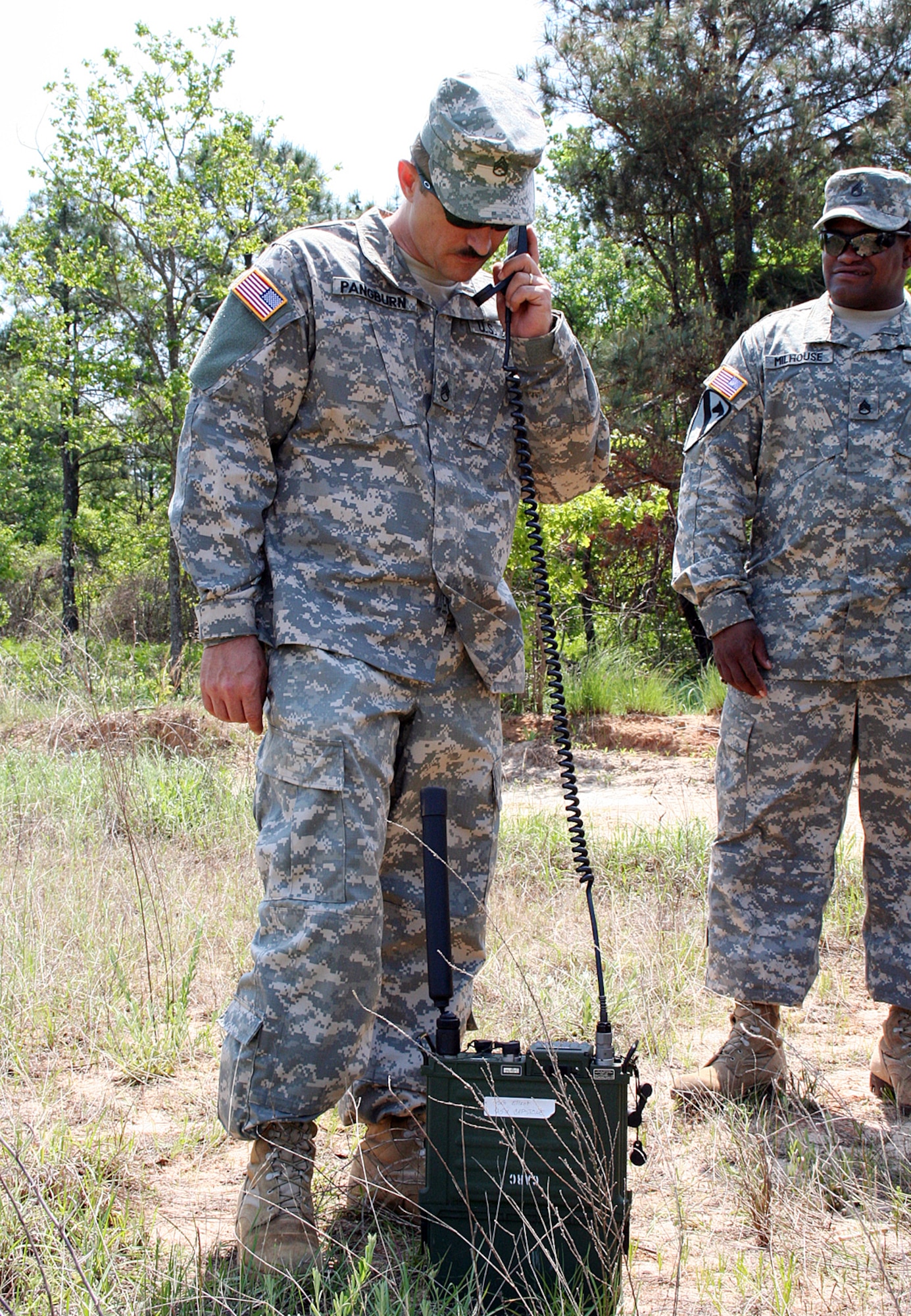 Army Staff Sgt. Robert Pangburn of the 551st Signal Battalion attempts to communicate using a Harris radio with a C-130 Hercules crew from the 700th Airlift Squadron out of Dobbins Air Reserve Base, Ga. The joint training is the first of its kind at Fort Gordon, Ga., and will be added to the final capstone event of Army communications technical training at Fort Gordon. (U.S. Army photo/Kristy Davies)