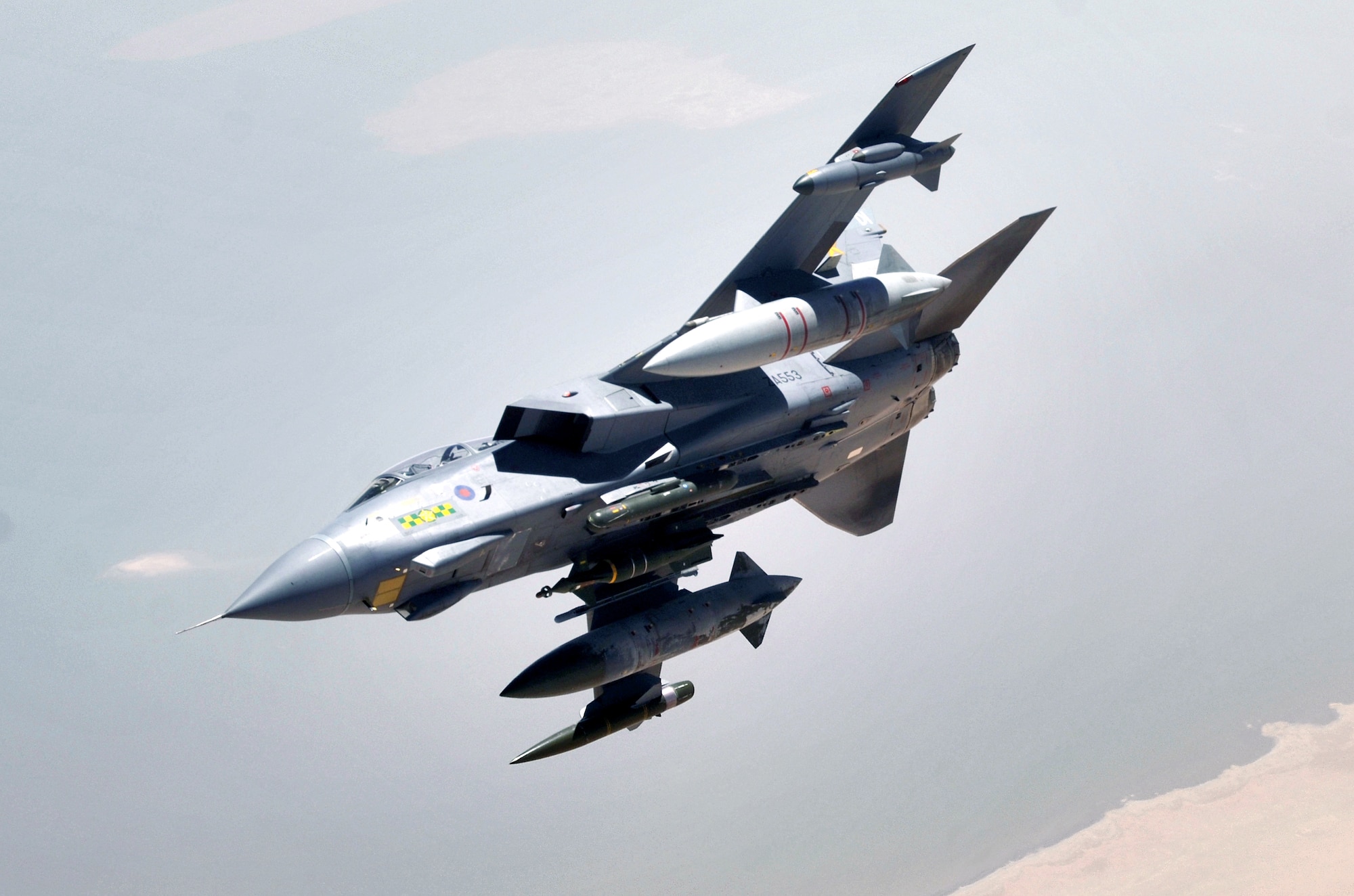 An RAF Tornado GR-4 pulls away from a KC-135 Stratotanker after refueling on Sunday, May 14, 2006. The Tornado and crew are from the 617th Squadron at RAF Lossiemouth, Scotland. The KC-135 and crew are deployed to the 340th Expeditionary Air Refueling Squadron from the 905th Air Refueling Squadron at Grand Forks Air Force Base, N.D. (U.S. Air Force photo/Master Sgt. Lance Cheung)