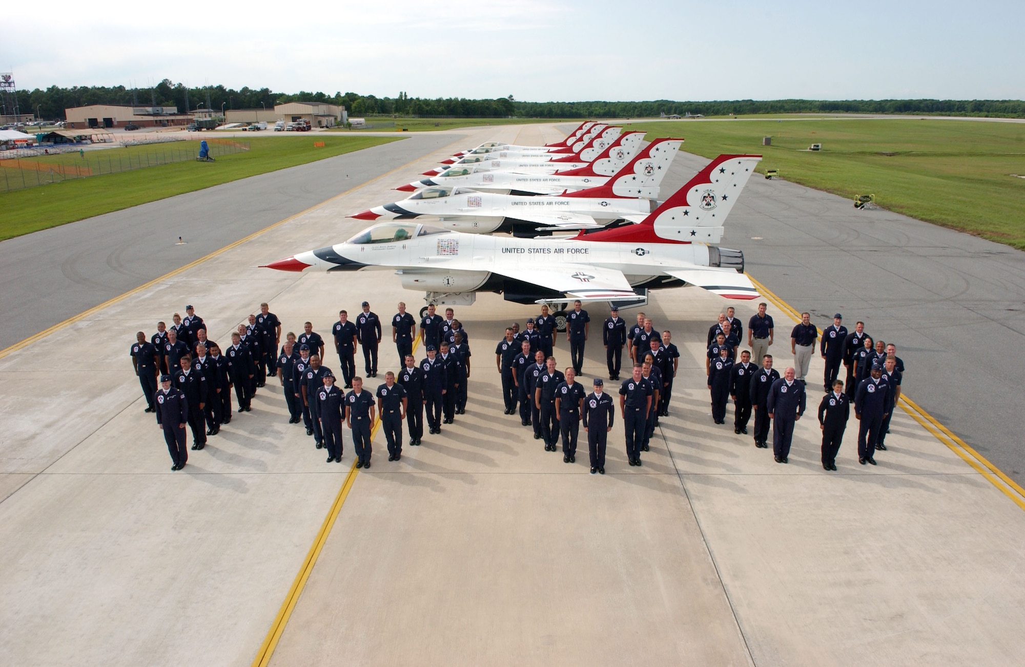 Airmen from the United States Air Force Air Demonstration Squadron, the Thunderbirds, line up to form the number 4,000 to commemorate the team's milestone air show on Saturday, May 13, 2006. (U.S. Air Force photo)

