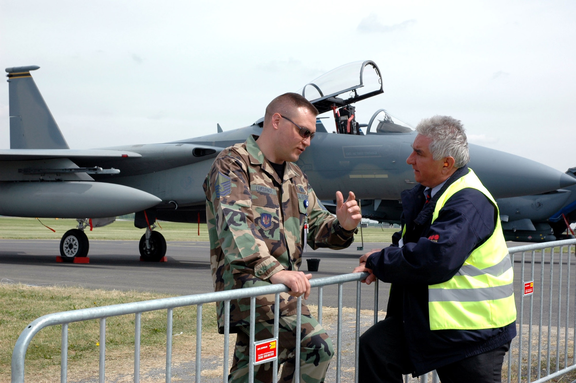 Master Sgt. Hank Liverance from Ramstein Air Base, Germany, discusses security with German airport security guard Hans Fedchenheuer on Monday, May 15, 2006 -- the day before the opening of the 2006 Berlin Air Show. (U.S. Air Force photo/Master Sgt. Chuck Roberts) 

