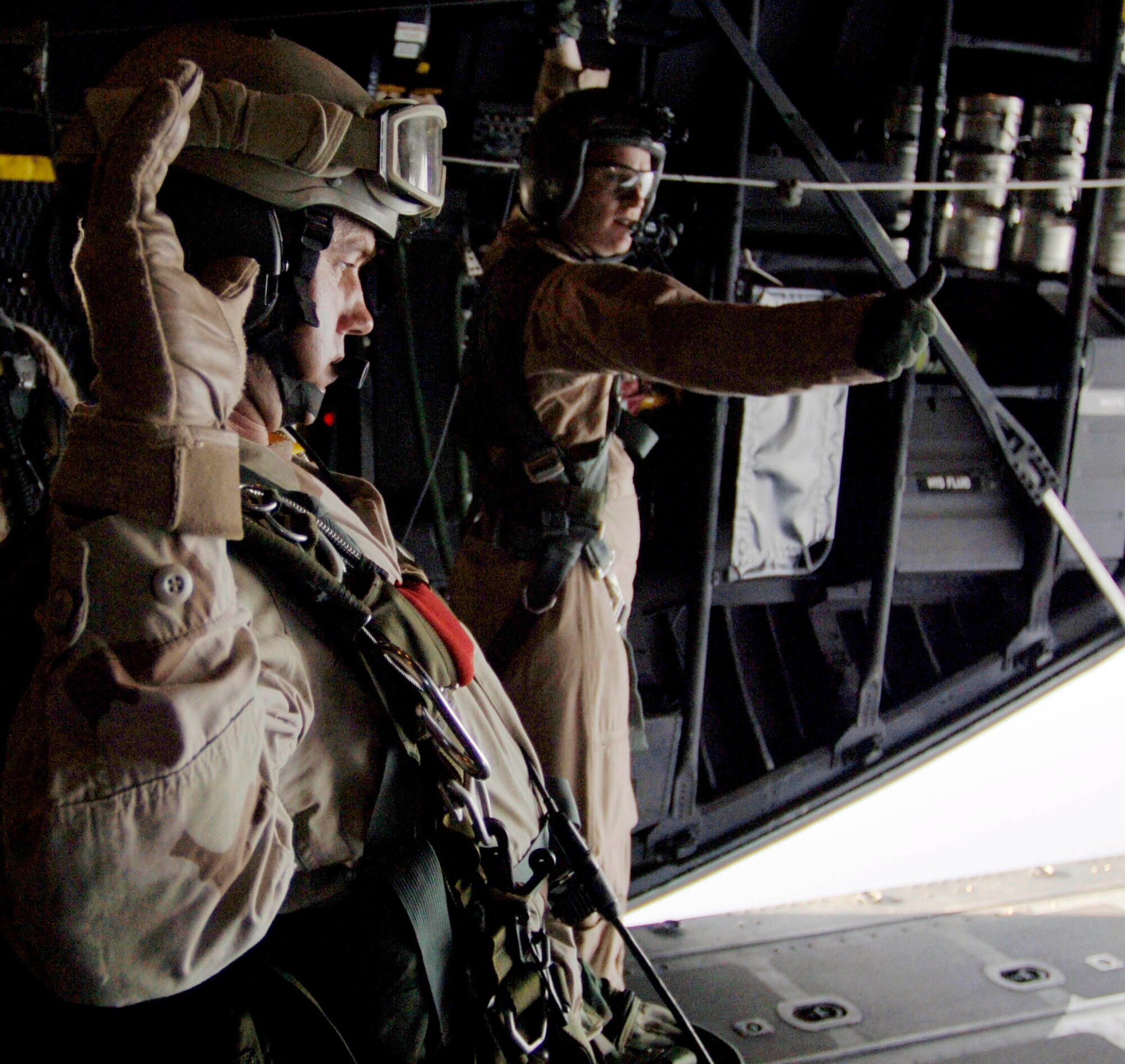 An Air Force pararescueman with the 304th Expeditionary Rescue Squadron waits for the signal to go just before his high-altitude jump over the Gulf of Tadjoura in Djibouti, Africa, on Thursday, May 11, 2006. (U.S. Navy photo/Photographer's Mate 2nd Class Scott Taylor) 
