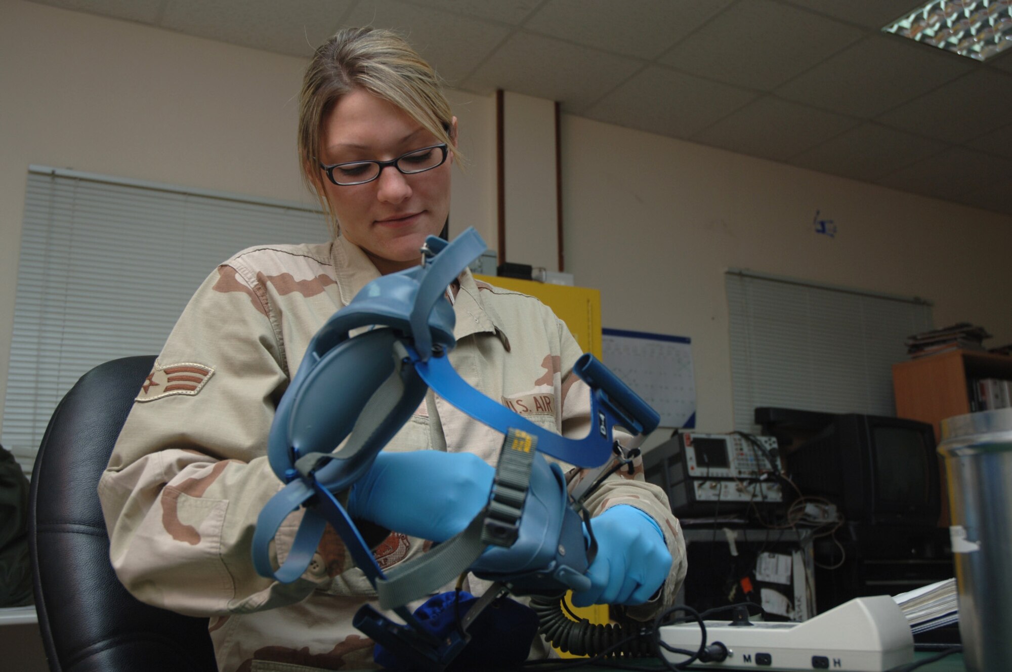 Senior Airman Chelsea Raymond cleans a quick-don oxygen mask in the C-130 Hercules life support section. She is a life support specialist assigned to the 379th Expeditionary Operational Support Squadron. (U.S. Air Force photo/Staff Sgt Joshua Strang)

