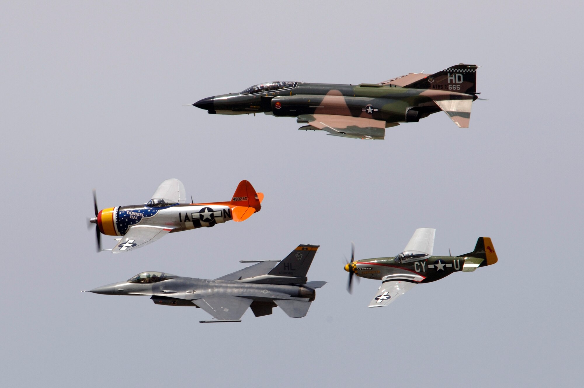 An F-4 Phantom, P-47 Thunderbolt, F-16 Fighting Falcon and P-51 Mustang fly in a heritage flight formation during the 2006 Defenders of Liberty Airshow at Barksdale Air Force Base, La., on Saturday, May 13, 2006. (U.S. Air Force photo/Master Sgt. Michael A. Kaplan) 

