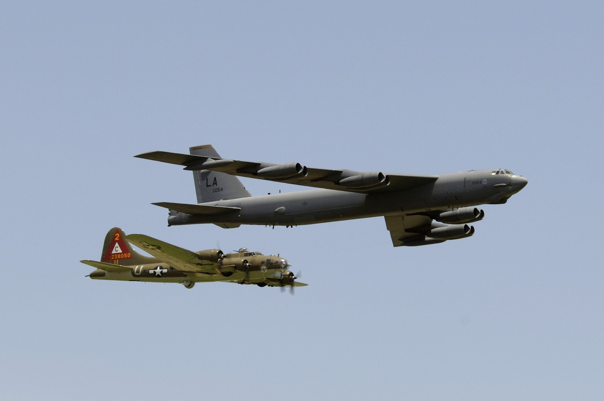 A B-17G Flying Fortress and a B-52H Stratofortress fly in a heritage flight formation May 13 during the 2006 Defenders of Liberty Airshow at Barksdale Air Force Base, La. These two aircraft represent 70 years of "fortresses." It was the first time in 50 years that they flew together in formation. (U.S. Air Force photo/Master Sgt. Michael A. Kaplan)