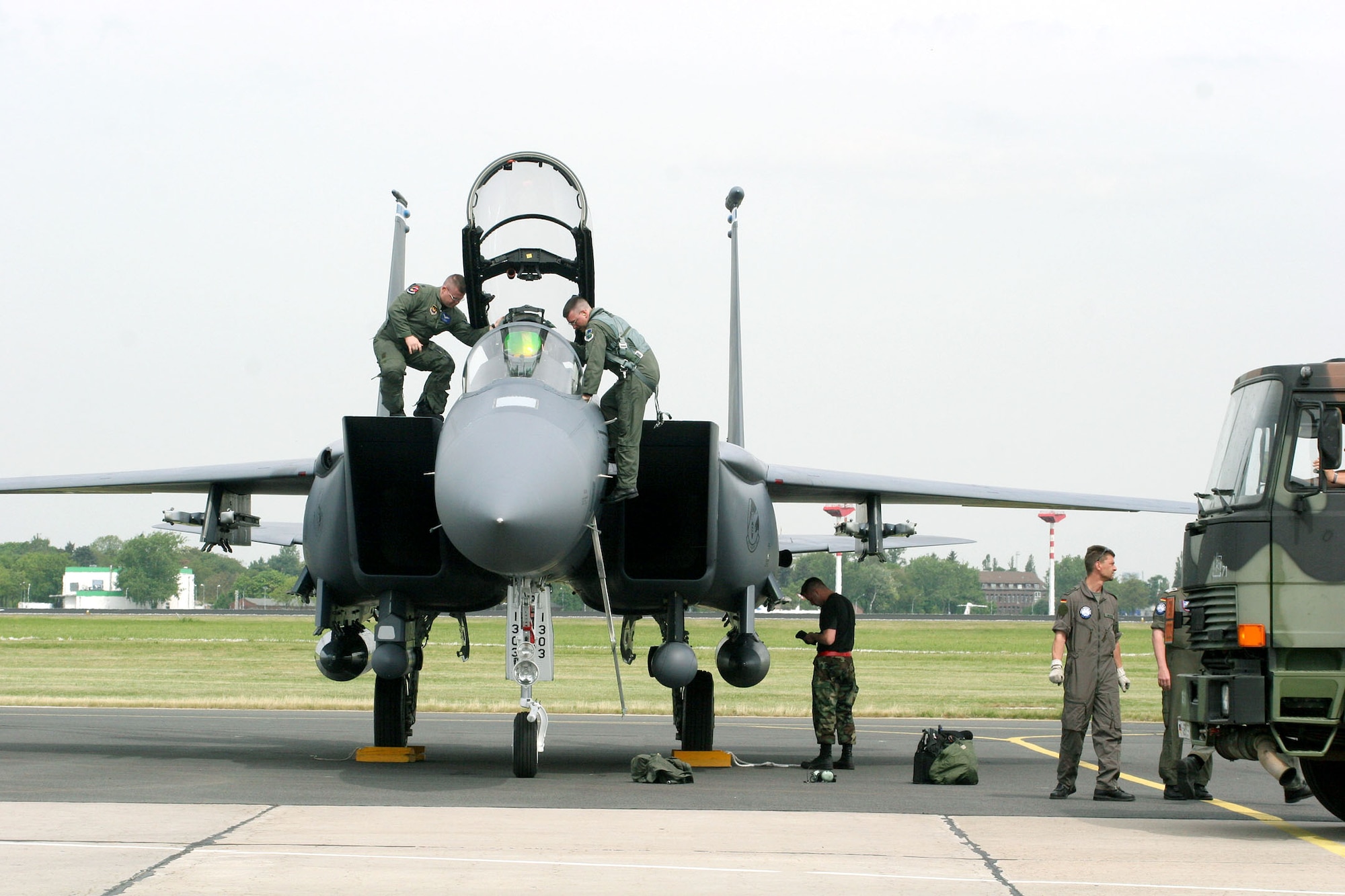 Air Force Capts. D.J. Vollmer (left) and John Beatty exit their F-15E Strike Eagle shortly after arriving at the Berlin Air Show May 15, 2006. Various models of U.S. military aircraft and about 60 support personnel from bases in Europe and the United States are attending the air show at Berlin-Schoenefeld Airport May 16-21. The two captains are pilots with the 493rd Fighter Squadron at Royal Air Force Lakenheath, England.  (U.S. Air Force photo/Maj. Pamela A.Q. Cook)