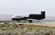 EDWARDS AIR FORCE BASE, Calif. - A Global Hawk unmanned aerial vehicle performs a high-speed taxi test on South Base here during Phase III of wet runway testing May 3. This is the first time wet runway tests have been conducted with a UAV. (Air Force photo by Bobbi Zapka)

