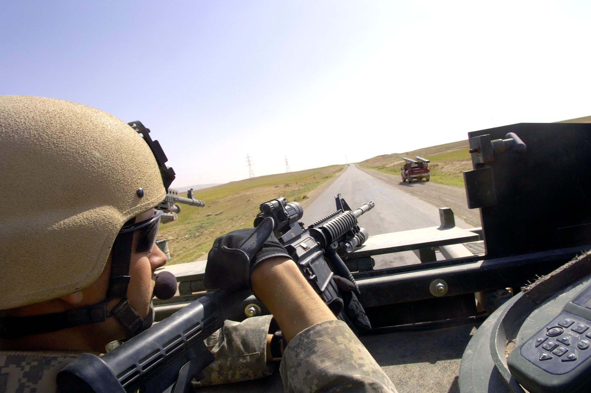 Staff Sgt. Chris Pierce provides rear security in a Stryker vehicle while on patrol near Sinjar, Iraq on May 14, 2006. Sergeant Pierce is a joint tactical air controller assigned to a U.S. Army Stryker brigade combat team. (U.S. Air Force photo/Staff Sgt. Jacob N. Bailey) 