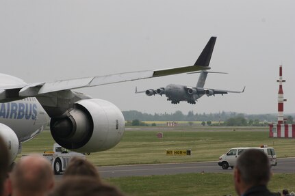 BERLIN, Germany - "The Spirit of Berlin" C-17 Globemaster III lands May 16 after a flight demonstration at the Berlin Air Show. The C-17 from Charleston Air Force Base, S.C., and other Air Force and Army aircraft are attending the air show at Berlin-Schoenefeld Airport May 16-21. The Berlin Air Show is one of the premier events of its type in the world, and U.S. military participation contributes to a number of U.S. security and foreign policy interests. Participation promotes standardization and interoperability of equipment with our NATO allies and other potential coalition partners, highlights the strength of the U.S. commitment to the security of Europe and demonstrates that U.S. industry is producing equipment that will be critical to the success of current and future military operations.  (Photo by Maj. Pamela A.Q. Cook, USAF)
