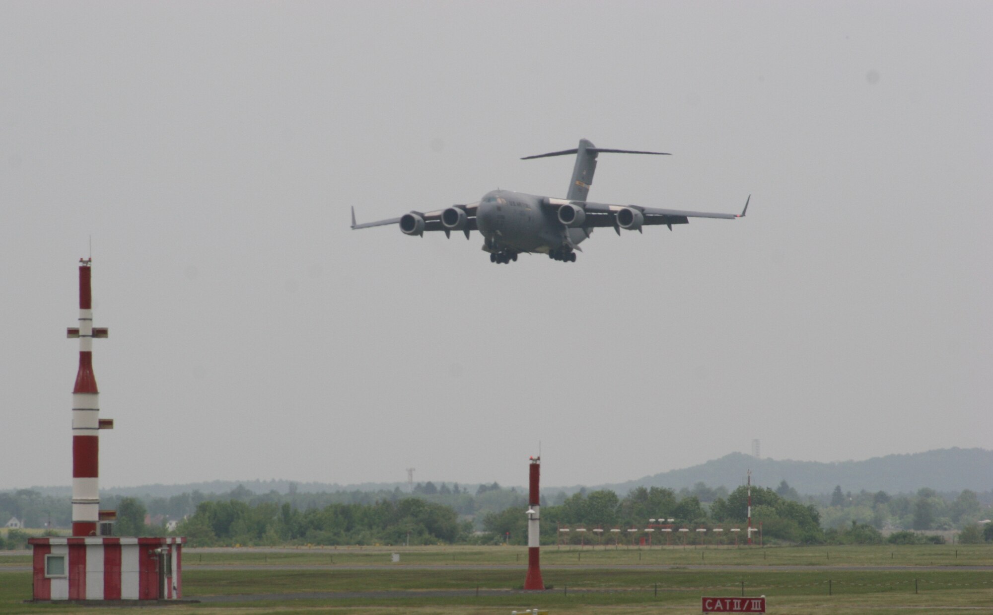BERLIN, Germany - "The Spirit of Berlin" C-17 Globemaster III lands May 16 after a flight demonstration at the Berlin Air Show. The C-17 from Charleston Air Force Base, S.C., and other Air Force and Army aircraft are attending the air show at Berlin-Schoenefeld Airport May 16-21. The Berlin Air Show is one of the premier events of its type in the world, and U.S. military participation contributes to a number of U.S. security and foreign policy interests. Participation promotes standardization and interoperability of equipment with our NATO allies and other potential coalition partners, highlights the strength of the U.S. commitment to the security of Europe and demonstrates that U.S. industry is producing equipment that will be critical to the success of current and future military operations.  (Photo by Maj. Pamela A.Q. Cook, USAF)
