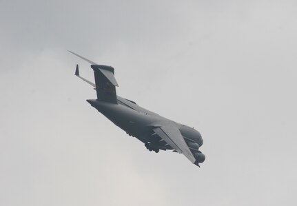 BERLIN, Germany - "The Spirit of Berlin" C-17 Globemaster III flies over the runway May 16 during a flight demonstration at the Berlin Air Show. The C-17 from Charleston Air Force Base, S.C., and other Air Force and Army aircraft are attending the air show at Berlin-Schoenefeld Airport May 16-21. The Berlin Air Show is one of the premier events of its type in the world, and U.S. military participation contributes to a number of U.S. security and foreign policy interests. Participation promotes standardization and interoperability of equipment with our NATO allies and other potential coalition partners, highlights the strength of the U.S. commitment to the security of Europe and demonstrates that U.S. industry is producing equipment that will be critical to the success of current and future military operations.  (Photo by Maj. Pamela A.Q. Cook, USAF)
