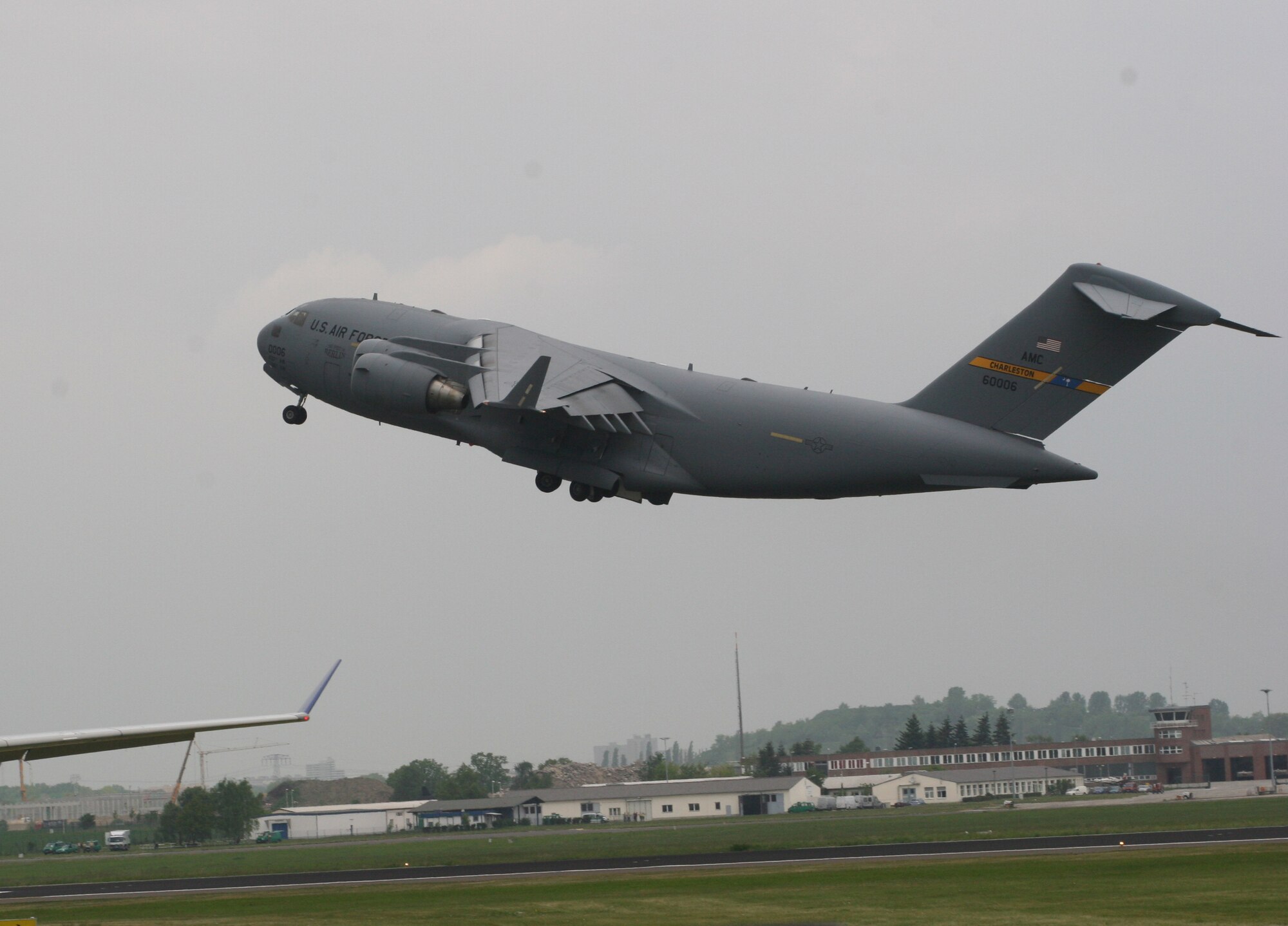 BERLIN, Germany - "The Spirit of Berlin" C-17 Globemaster III takes off May 16 for a flight demonstration at the Berlin Air Show. The C-17 from Charleston Air Force Base, S.C., and other Air Force and Army aircraft are attending the air show at Berlin-Schoenefeld Airport May 16-21. The Berlin Air Show is one of the premier events of its type in the world, and U.S. military participation contributes to a number of U.S. security and foreign policy interests. Participation promotes standardization and interoperability of equipment with our NATO allies and other potential coalition partners, highlights the strength of the U.S. commitment to the security of Europe and demonstrates that U.S. industry is producing equipment that will be critical to the success of current and future military operations. (Photo by Maj. Pamela A.Q. Cook, USAF)
